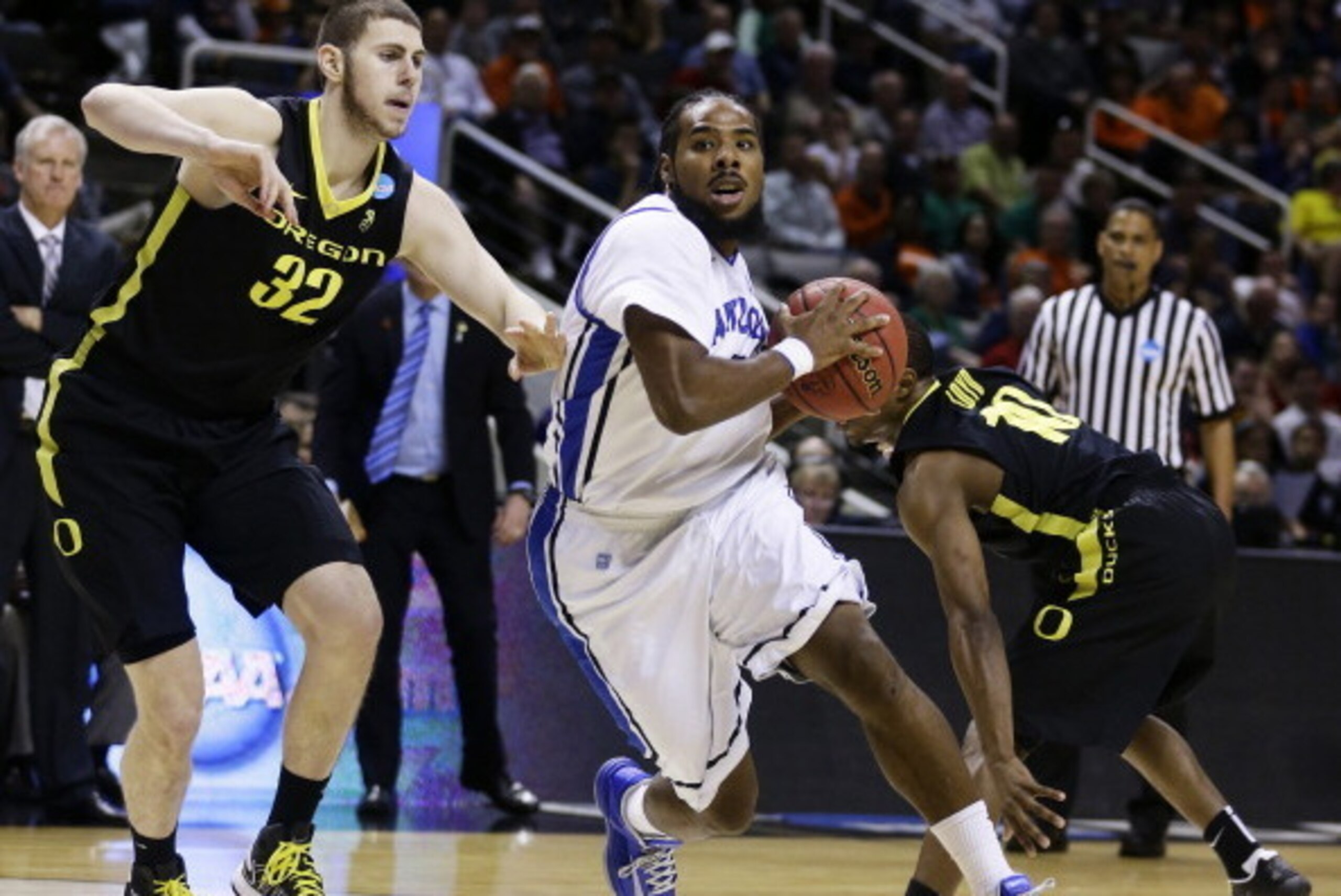 SAN JOSE, CA - MARCH 23:  Jordair Jett #5 of the Saint Louis Billikens drives against Ben Carter #32 and Johnathan Loyd #10 of the Oregon Ducks in the second half during the third round of the 2013 NCAA Men's Basketball Tournament at HP Pavilion on March 