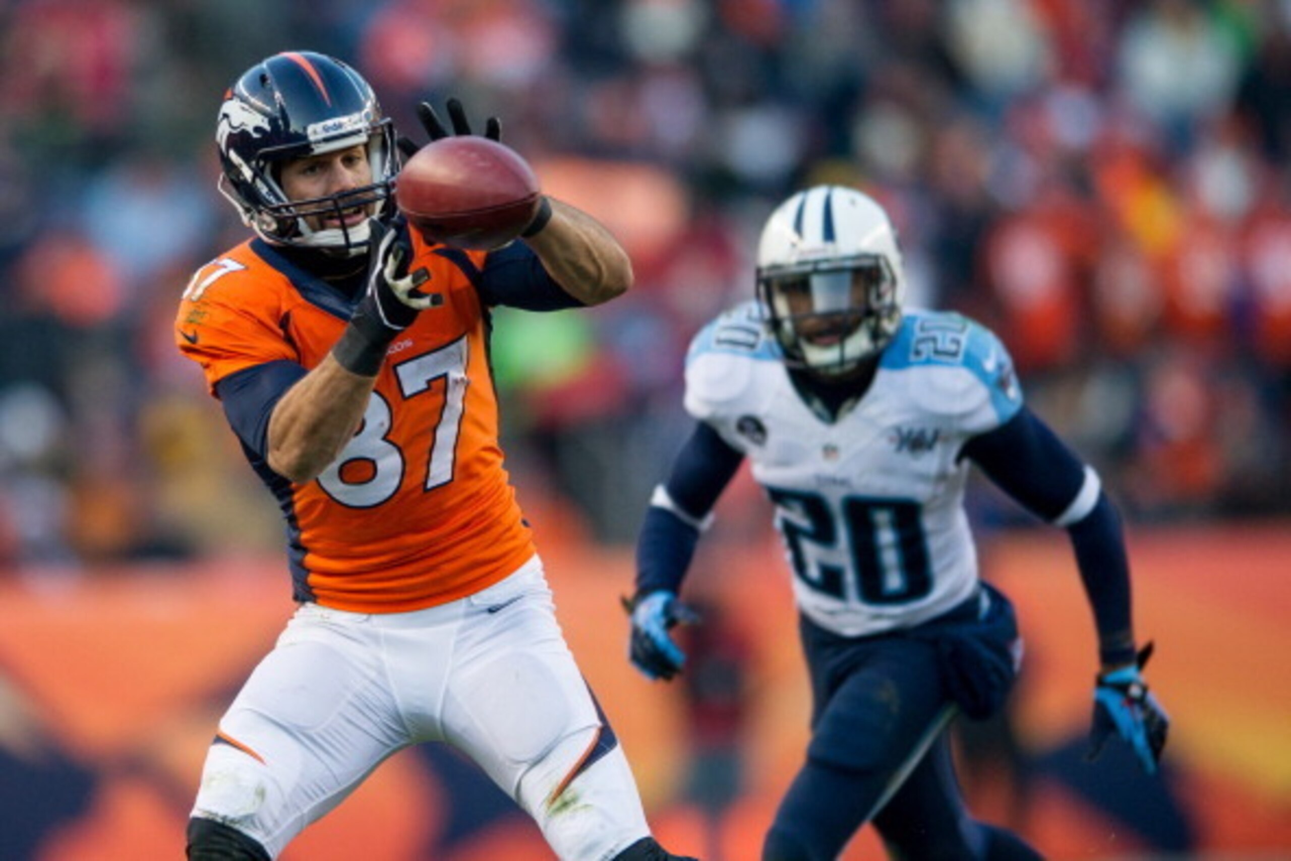 DENVER, CO - DECEMBER 8:  Wide receiver Eric Decker #87 of the Denver Broncos hauls in a second quarter pass against the Tennessee Titans at Sports Authority Field Field at Mile High on December 8, 2013 in Denver, Colorado.  (Photo by Dustin Bradford/Gett
