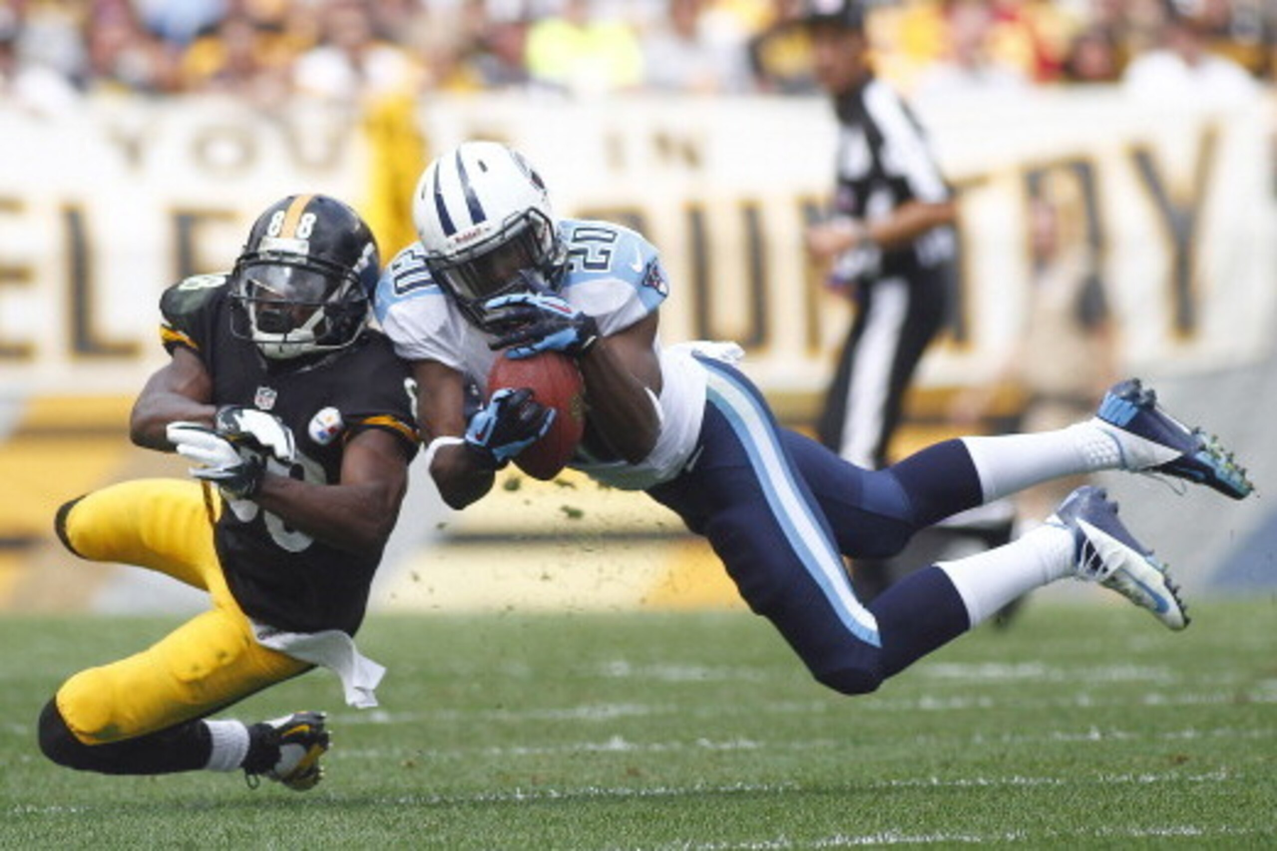 PITTSBURGH, PA - SEPTEMBER 08: Alterraun Verner #20 of the Tennessee Titans intercepts a pass intended for Emmanuel Sanders #88 of the Pittsburgh Steelers in the first half during the game on September 8, 2013 at Heinz Field in Pittsburgh, Pennsylvania. (