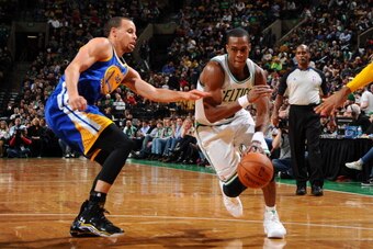 BOSTON, MA - MARCH 5: Rajon Rondo #9 of the Boston Celtics drives against Stephen Currry #30 of the Golden State Warriors on March 5, 2014 at the TD Garden in Boston, Massachusetts.  NOTE TO USER: User expressly acknowledges and agrees that, by downloadin
