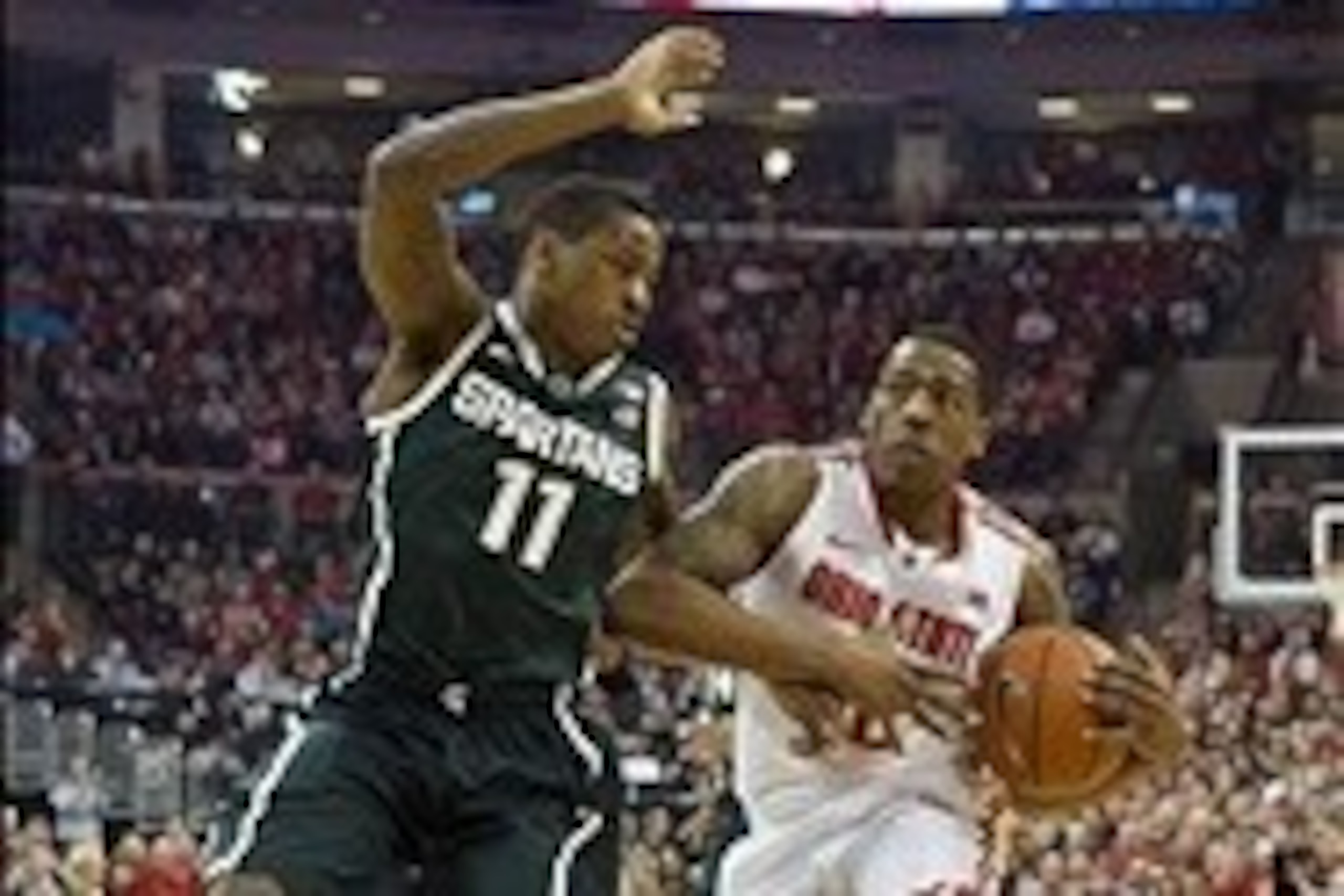 Mar 9, 2014; Columbus, OH, USA; Ohio State Buckeyes guard Lenzelle Smith Jr. (32) drives past Michigan State Spartans guard Keith Appling (11) at the Schottenstein Center. Mandatory Credit: Greg Bartram-USA TODAY Sports