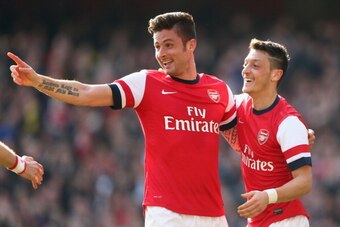LONDON, ENGLAND - MARCH 08:  Olivier Giroud of Arsenal celebrates with teammate Mesut Oezil after scoring his team's fourth goal during the FA Cup Quarter-Final match between Arsenal and Everton at Emirates Stadium on March 8, 2014 in London, England.  (P