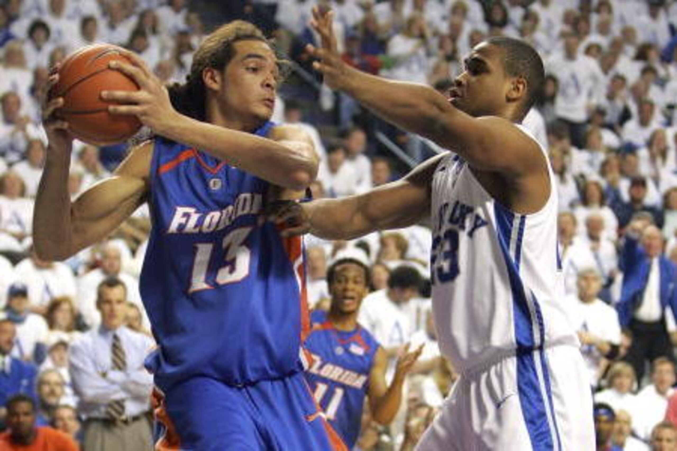 LEXINGTON, KY - FEBRUARY 10: Sheray Thomas #23 of the Kentucky Wildcatsputs defensive pressure on Joakim Noah #13 of the Florida Gators during the game on Feburary 10, 2007 at Rupp Arena in Lexington, Kentucky.  (Photo by Andy Lyons/Getty Images)