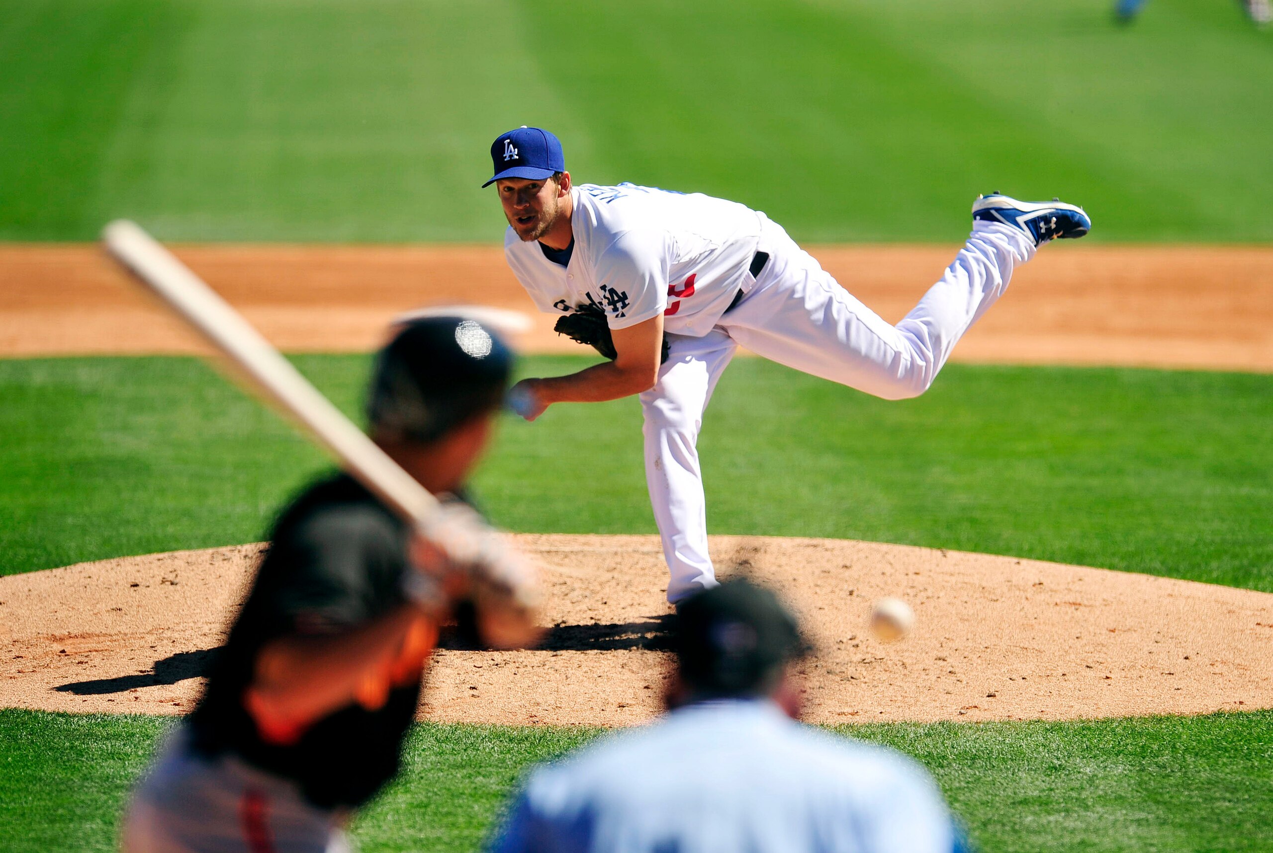 Mar 9, 2014; Glendale, AZ, USA; Los Angeles Dodgers starting pitcher Clayton Kershaw (22) pitches the third inning against the San Francisco Giants at Camelback Ranch. Mandatory Credit: Gary A. Vasquez-USA TODAY Sports