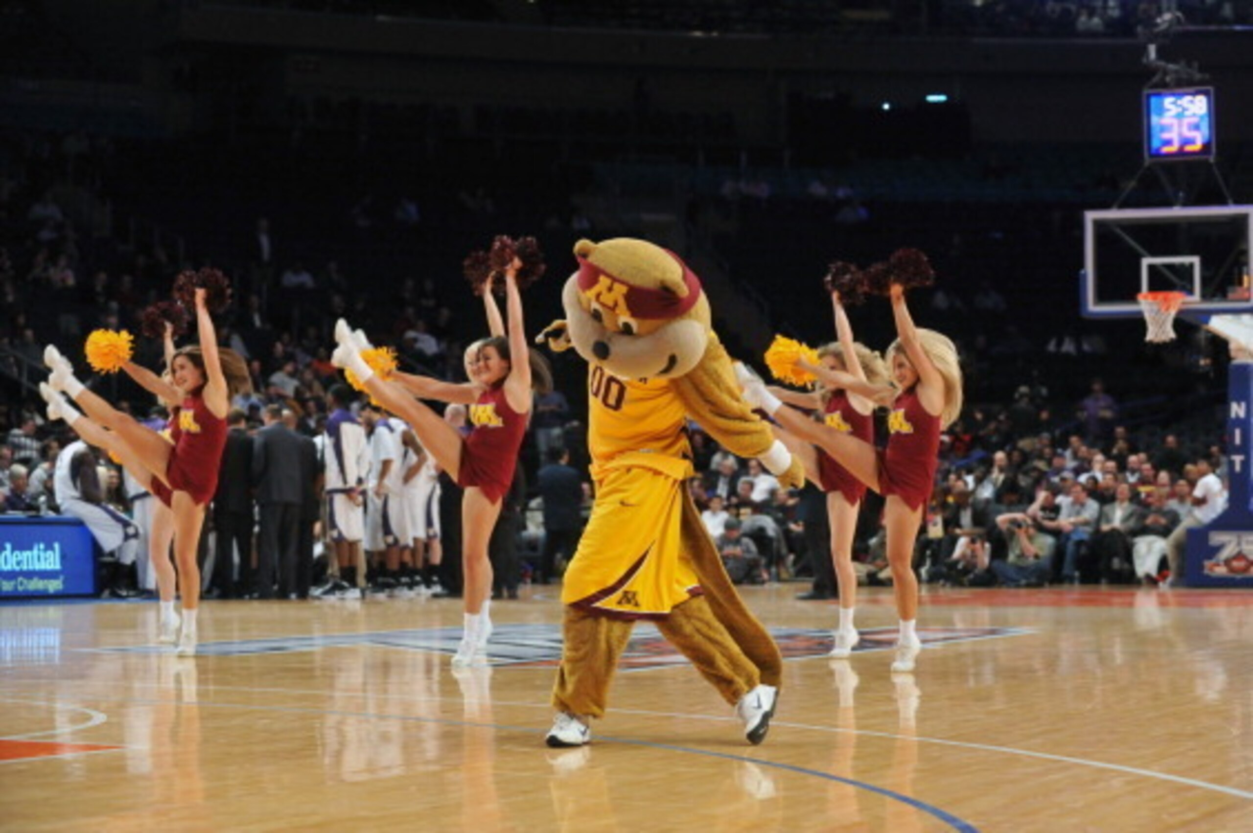 NEW YORK, NY - MARCH 27: The Minnesota Golden Golphers cheerleaders and mascot Goldy Gopher perform during the game against the Washington Huskies in the semifinals of the 2012 NCAA NIT Men's Basketball Championship at Madison Square Garden on March 27, 2