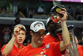 Mar 17, 2013; Chicago, IL, USA; Ohio State Buckeyes guard Aaron Craft holds up the tournament MVP trophy after the championship game of the Big Ten tournament against the Wisconsin Badgers at the United Center. Ohio State won 50-43. Mandatory Credit: Denn