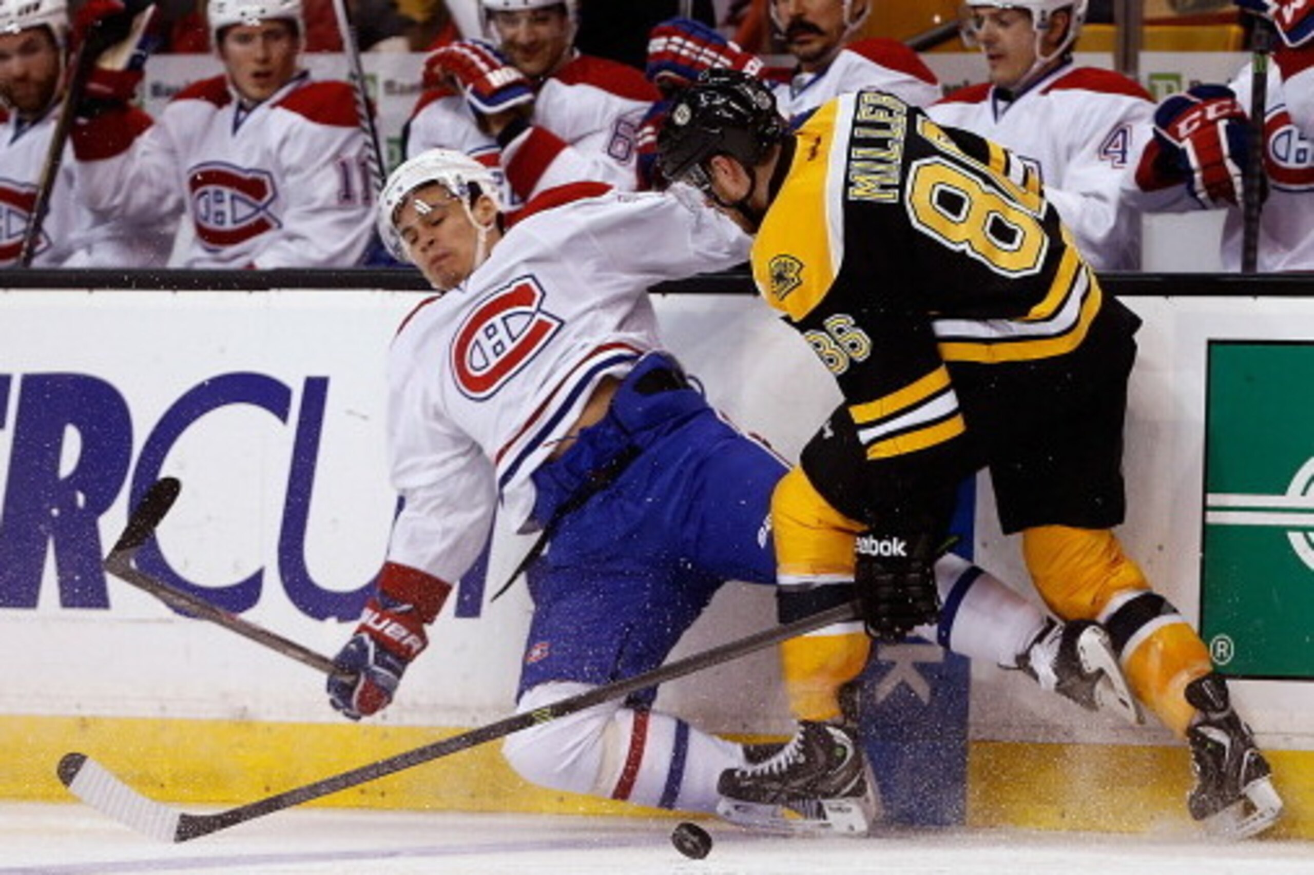 BOSTON, MA - JANUARY 30:  Kevan Miller #86 of the Boston Bruins collides with Rene Bourque #17 of the Montreal Canadiens in the 2nd period at TD Garden on January 30, 2014 in Boston, Massachusetts.  The Canadiens won 4-1. (Photo by Jim Rogash/Getty Images