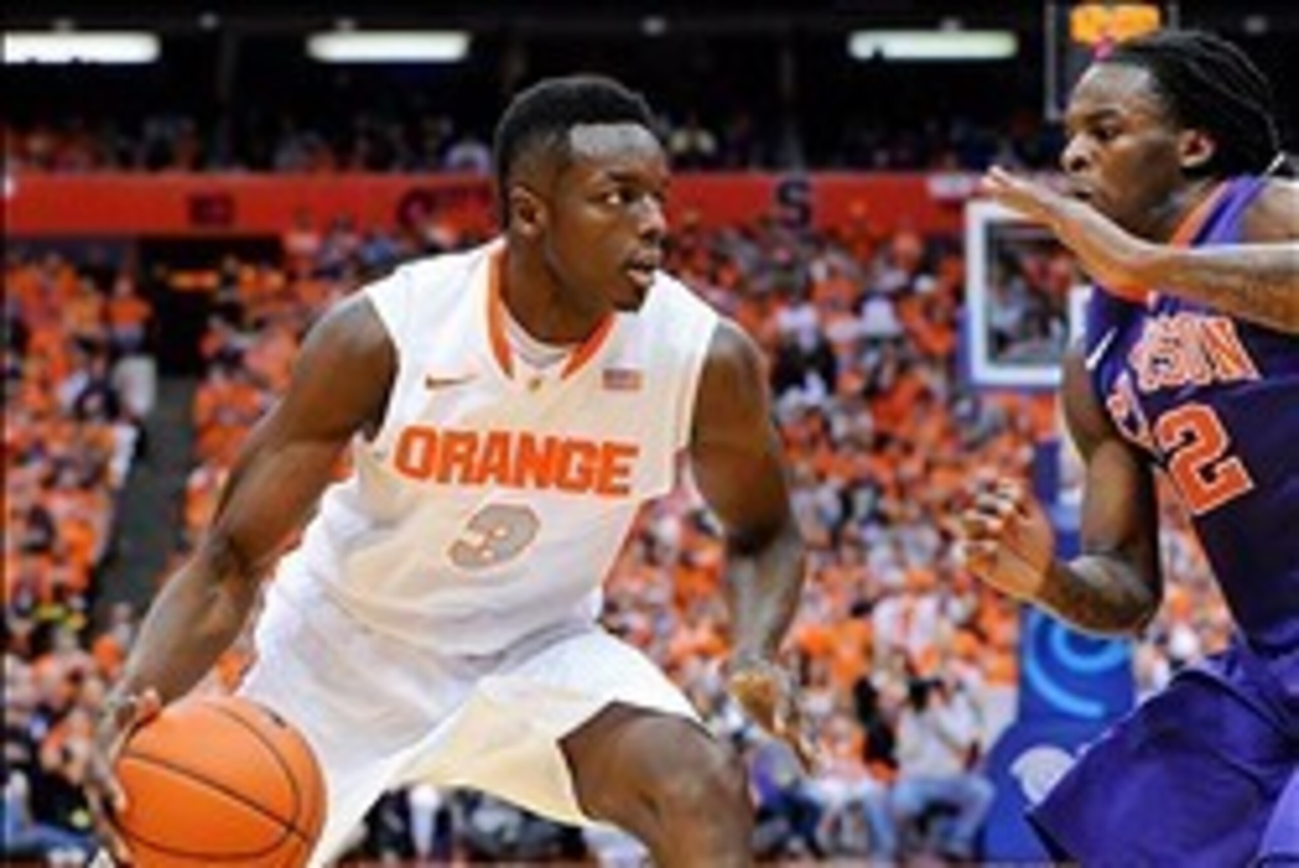Feb 9, 2014; Syracuse, NY, USA; Syracuse Orange forward Jerami Grant (3) drives to the basket against the defense of Clemson Tigers guard Rod Hall (12) during the first half at the Carrier Dome.  Syracuse defeated Clemson 57-44.  Mandatory Credit: Rich Ba
