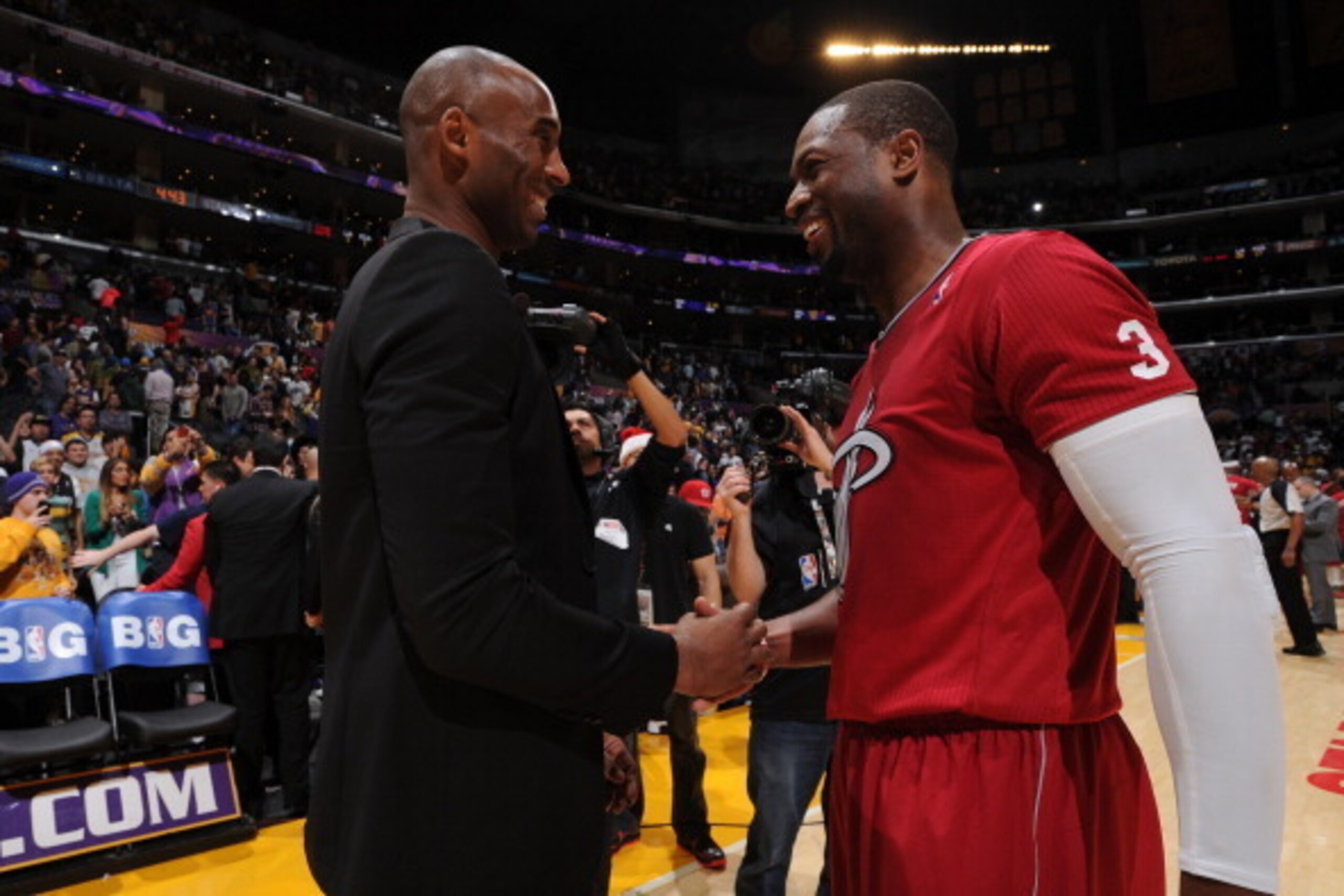 LOS ANGELES, CA - DECEMBER 25: Dwyane Wade #3 of the Miami Heat and Kobe Bryant #24 of the Los Angeles Lakers converse after a game at STAPLES Center on December 25, 2013 in Los Angeles, California. NOTE TO USER: User expressly acknowledges and agrees tha