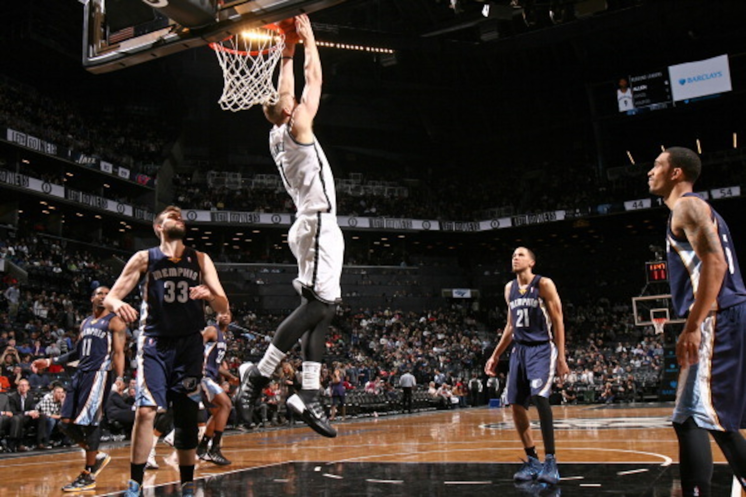 BROOKLYN, NY - MARCH 5: Mason Plumlee #1 of the Brooklyn Nets dunks against the Memphis Grizzlies at the Barclays Center on March 5, 2014 in the Brooklyn borough of New York City.  NOTE TO USER: User expressly acknowledges and agrees that, by downloading 