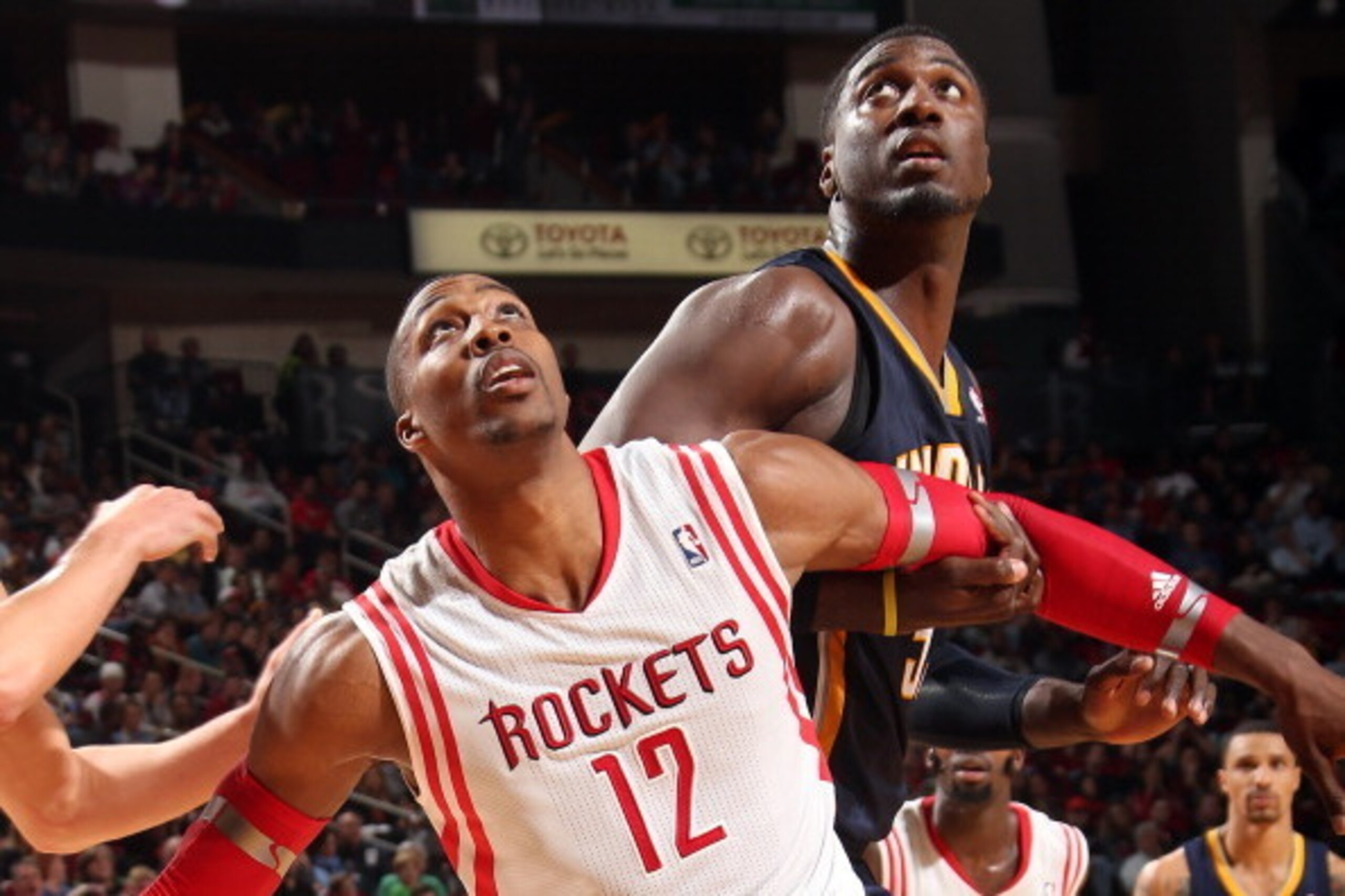 HOUSTON, TX - DECEMBER 28: Dwight Howard #12 of the Houston Rockets battles for rebound position against the Indiana Pacers on March 7, 2014 at the Toyota Center in Houston, Texas. NOTE TO USER: User expressly acknowledges and agrees that, by downloading 