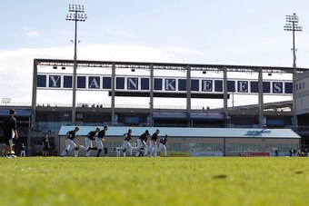 Feb 15, 2014; Tampa, FL, USA; New York Yankees players run on the field during spring training at George M. Steinbrenner Field. Mandatory Credit: Kim Klement-USA TODAY Sports