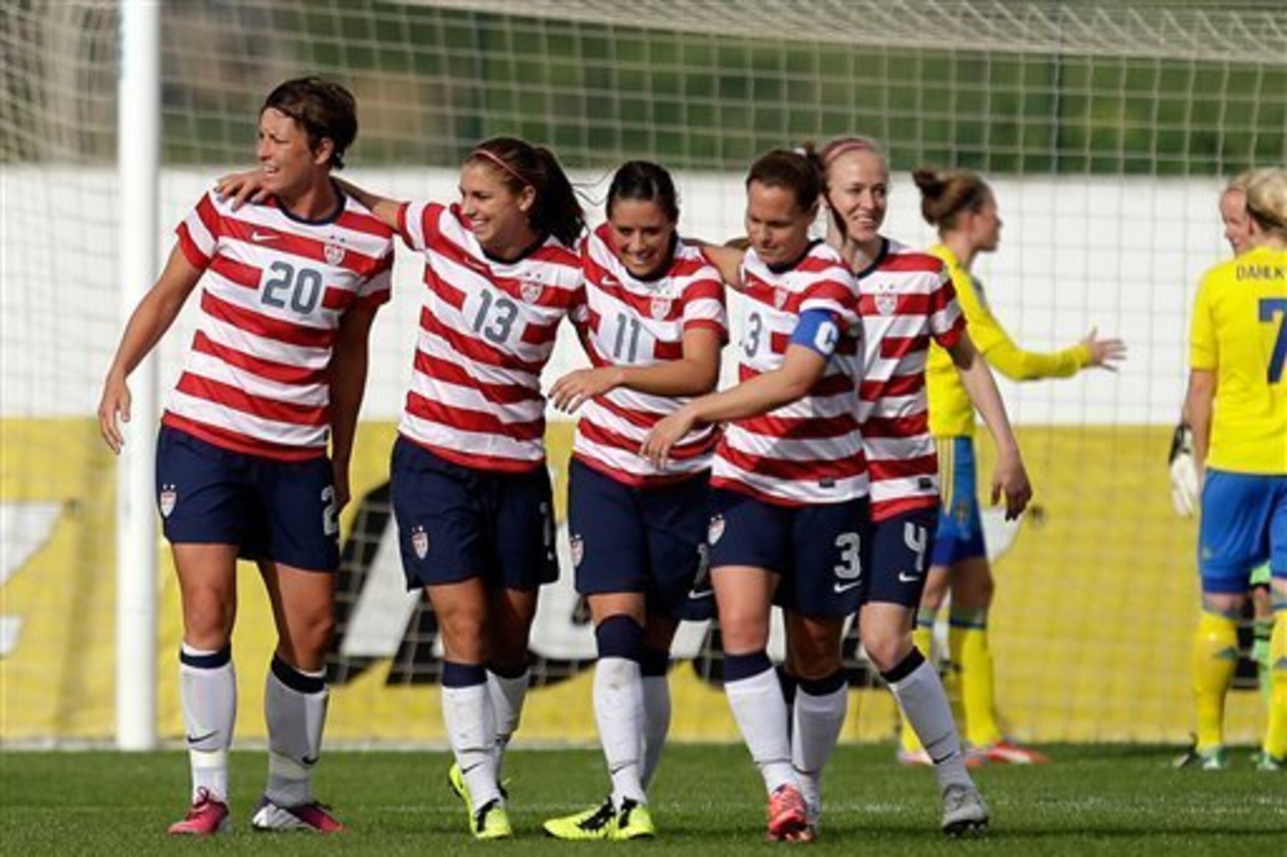 Alex Morgan, 2nd left, of the US, celebrates after scoring a goal against Sweden during their Algarve Cup  women's soccer match Monday, March 11, 2013, in Lagos, southern Portugal. (AP Photo/Armando Franca)