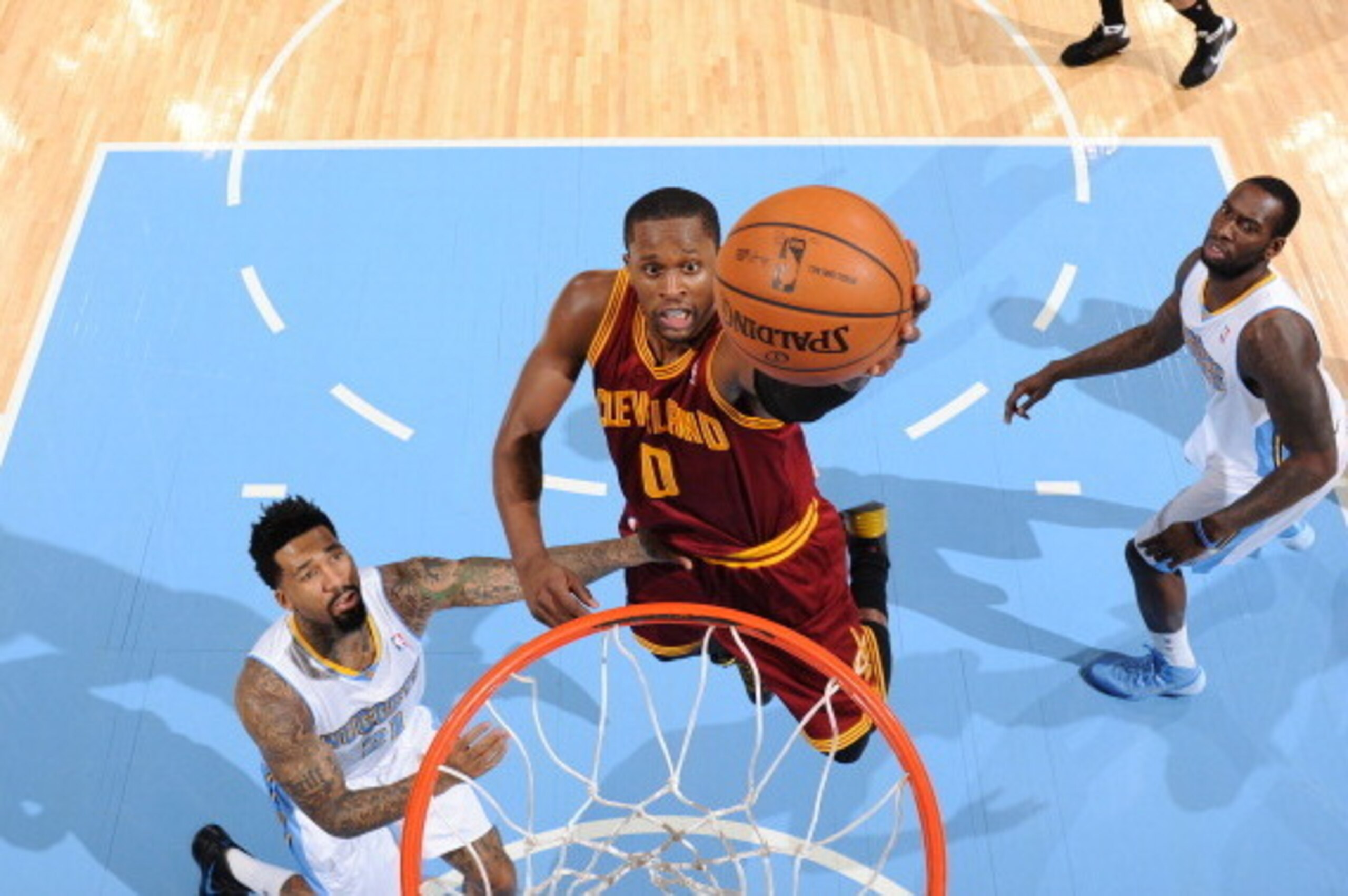 DENVER, CO - January 17: C.J. Miles #0 of the Cleveland Cavaliers making a layup during a game against the Denver Nuggets on January 17, 2014 at the Pepsi Center in Denver, Colorado. NOTE TO USER: User expressly acknowledges and agrees that, by downloadin