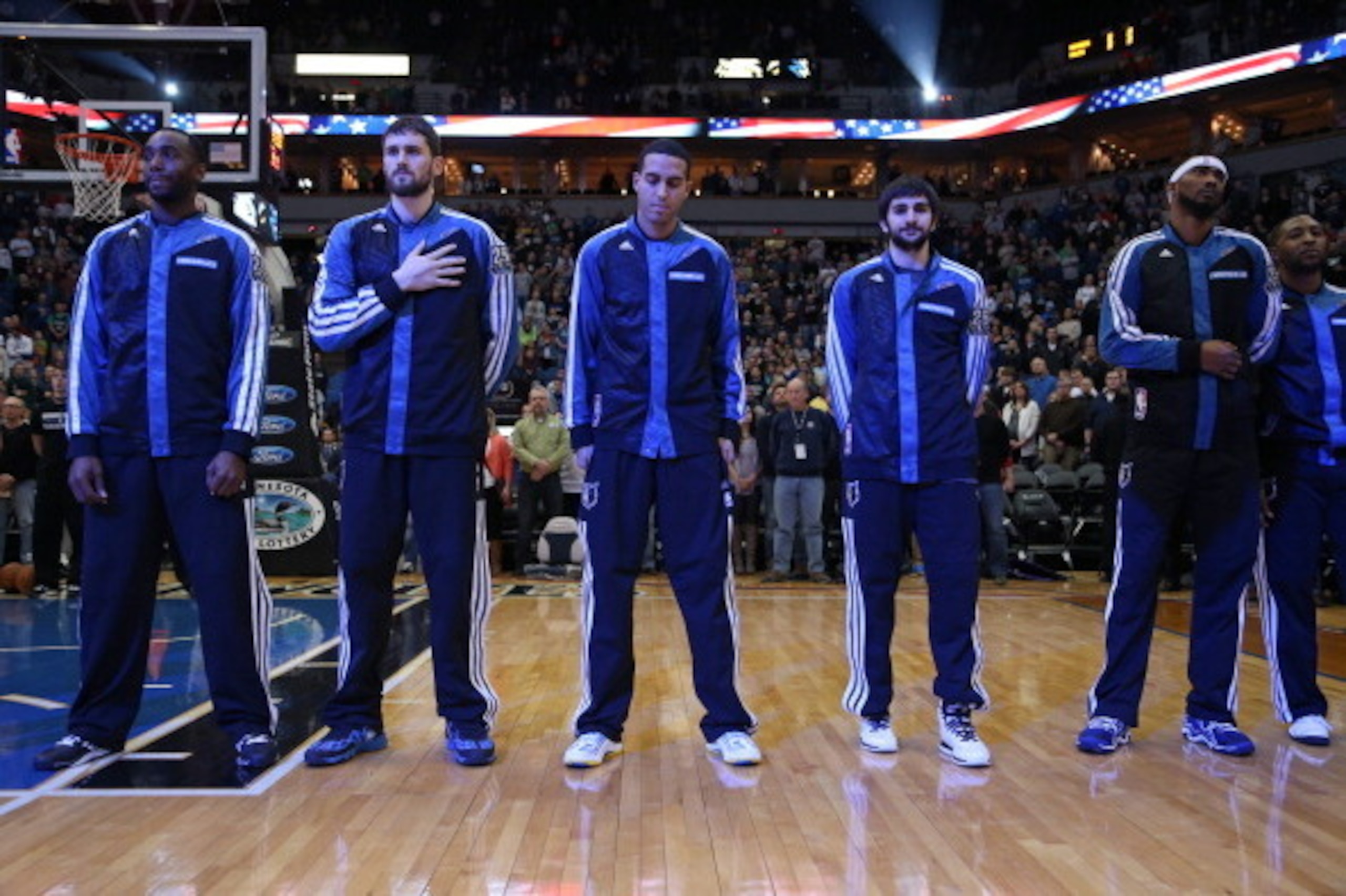 MINNEAPOLIS, MN - DECEMBER 30:  Luc Richard Mbah a Moute #12, Kevin Love #42, Kevin Martin #23, Ricky Rubio #9 and Corey Brewer #13 of the Minnesota Timberwolves stand on the court before the game against the Dallas Mavericks on December 30, 2013 at Targe
