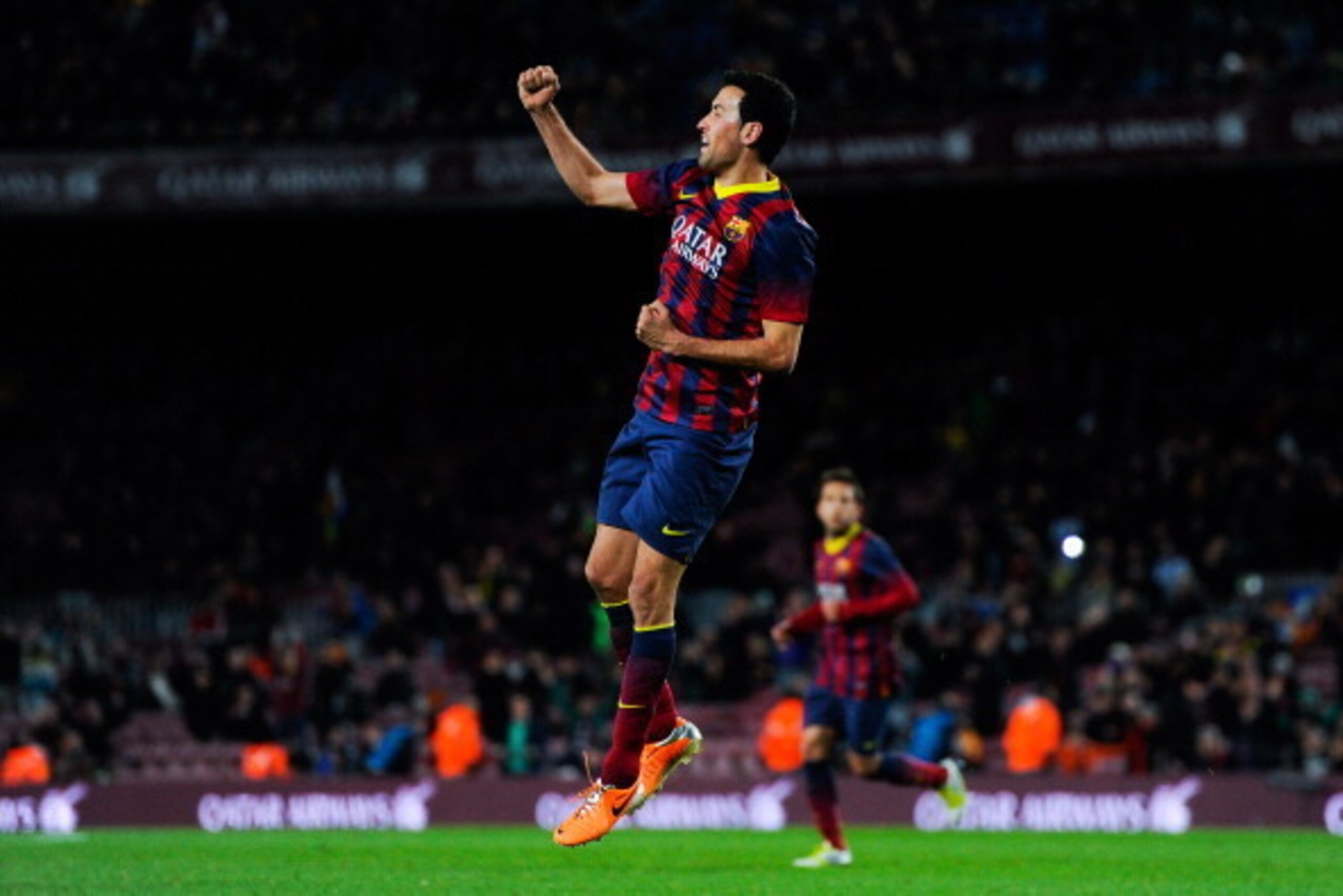 BARCELONA, SPAIN - FEBRUARY 05:  Sergio Busquets of FC Barcelona celebrates after scoring the opening goal during the Copa del Rey Semi-Final first leg match between Barcelona and Real Sociedad at Camp Nou on February 5, 2014 in Barcelona, Spain.  (Photo 