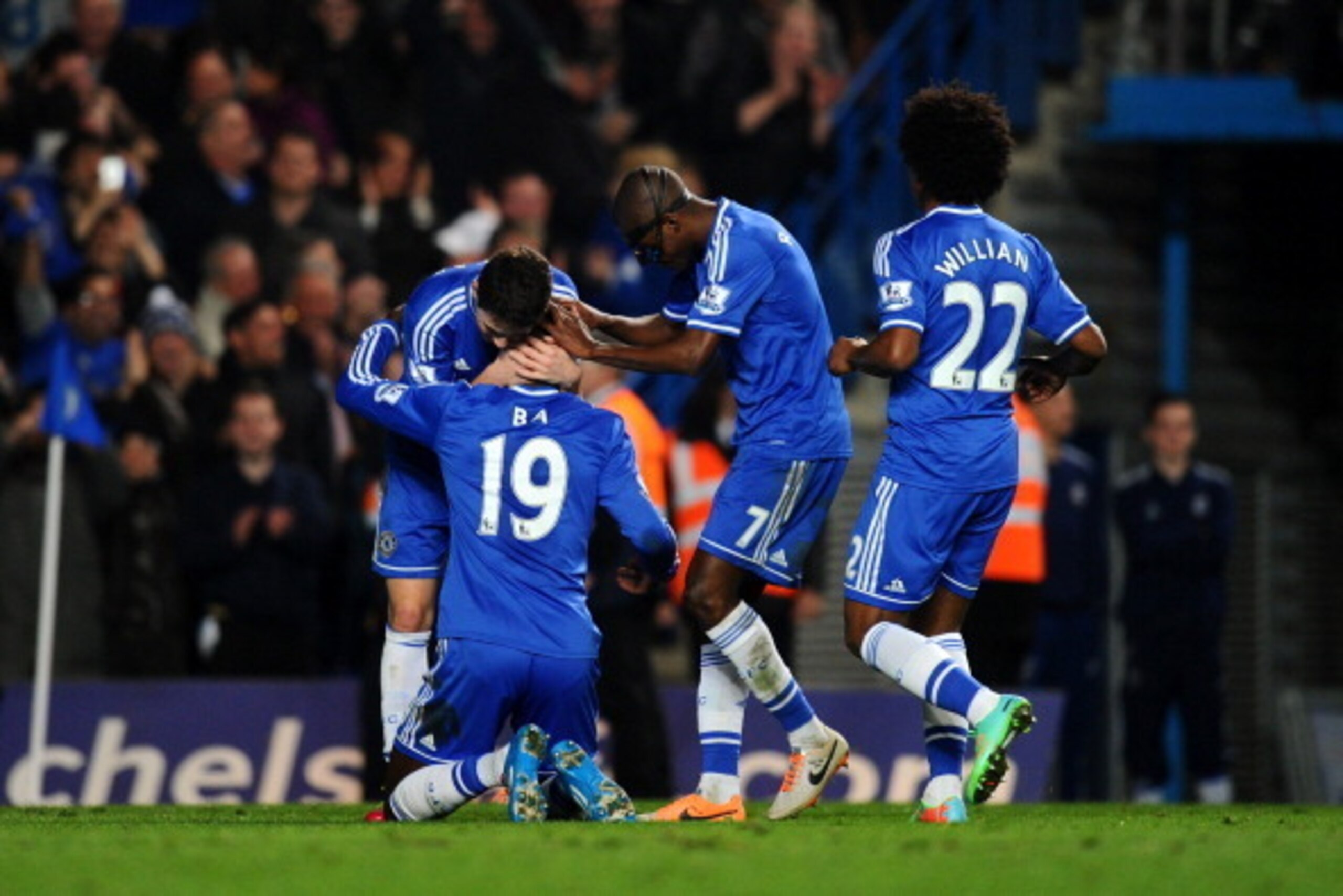LONDON, ENGLAND - MARCH 08:  (L-R) Demba Ba #19 of Chelsea celebrates with teammates Oscar, Ramires and Willian after scoring his team's fourth goal during the Barclays Premier League match between Chelsea and Tottenham Hotspur at Stamford Bridge on March