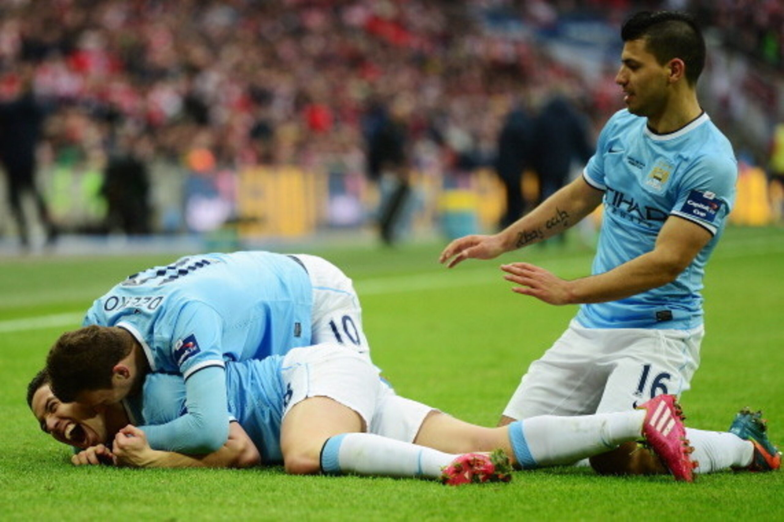 LONDON, ENGLAND - MARCH 02:  Samir Nasri of Manchester City celebrates his goal with Edin Dzeko and Sergio Aguero (R) during the Capital One Cup Final between Manchester City and Sunderland at Wembley Stadium on March 2, 2014 in London, England.  (Photo b