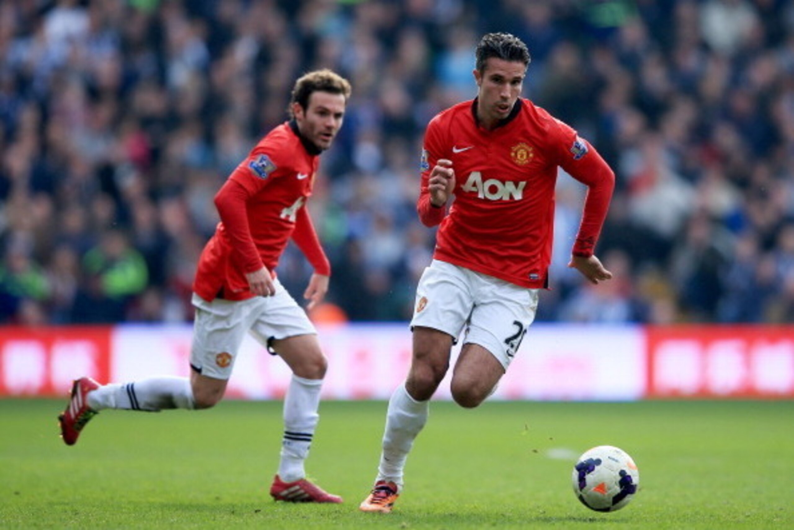 WEST BROMWICH, ENGLAND - MARCH 08:  Robin van Persie and Juan Mata of Manchester United in action during the Barclays Premier League match between West Bromwich Albion and Manchester United at The Hawthorns on March 8, 2014 in West Bromwich, England.  (Ph