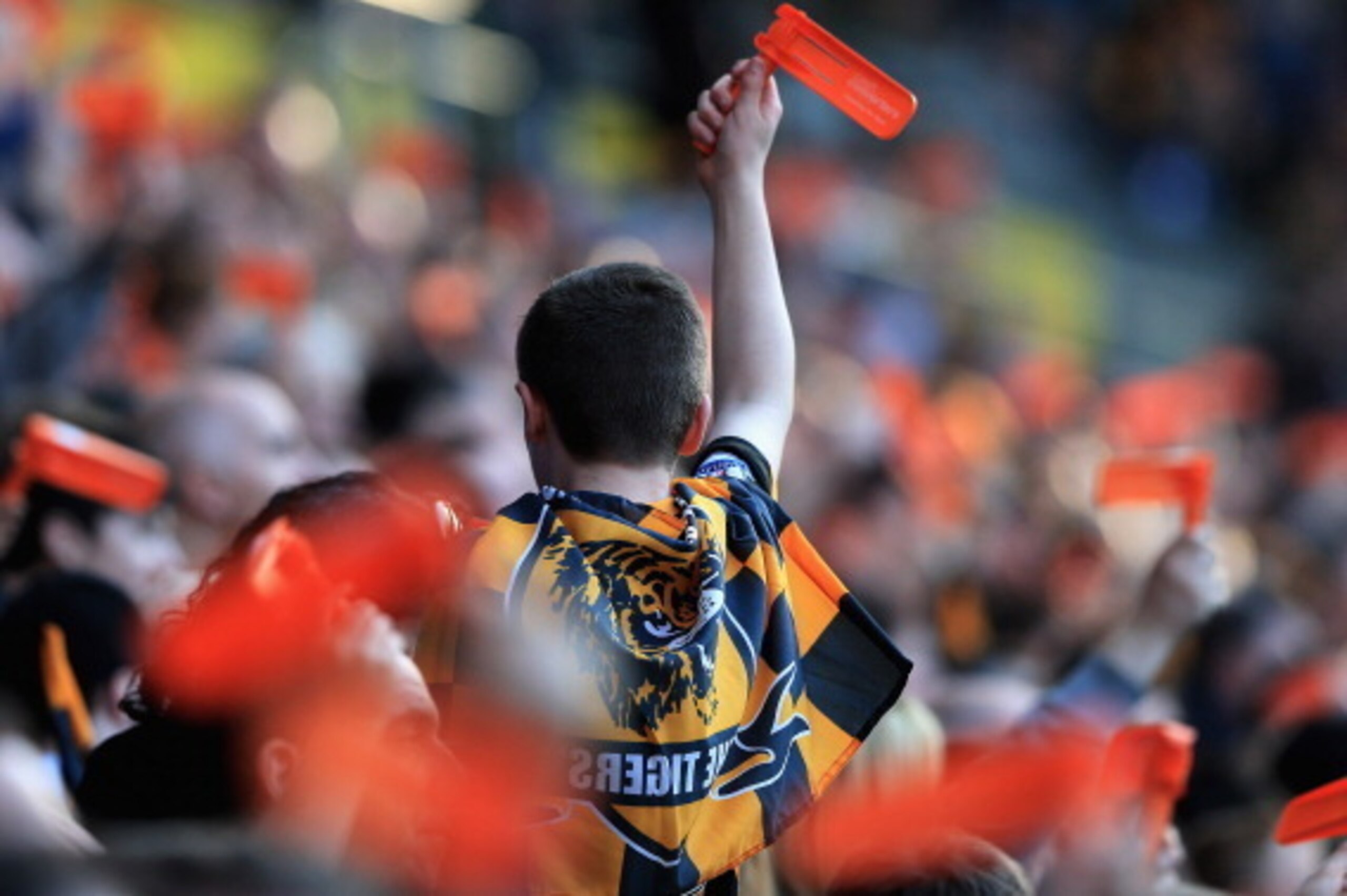 HULL, ENGLAND - MARCH 09:  A young Hull City supporter celebrates his teams win after the FA Cup Quarter Final match between Hull City and Sunderland at KC Stadium on March 9, 2014 in Hull, England.  (Photo by Matthew Lewis/Getty Images)