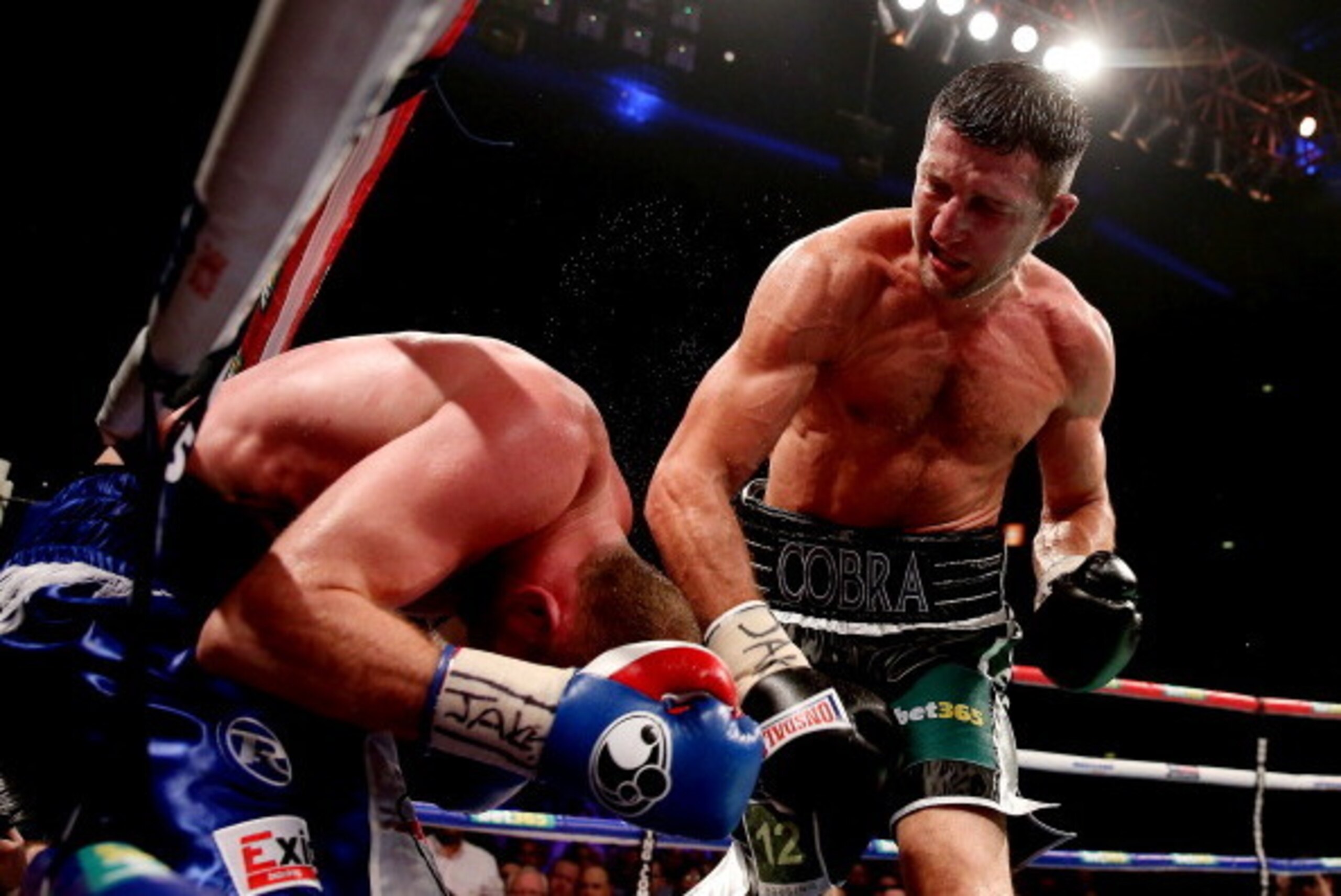 MANCHESTER, ENGLAND - NOVEMBER 23:  Carl Froch (R) in action with George Groves during their IBF and WBA World Super Middleweight bout at Phones4u Arena on November 23, 2013 in Manchester, England.  (Photo by Scott Heavey/Getty Images)