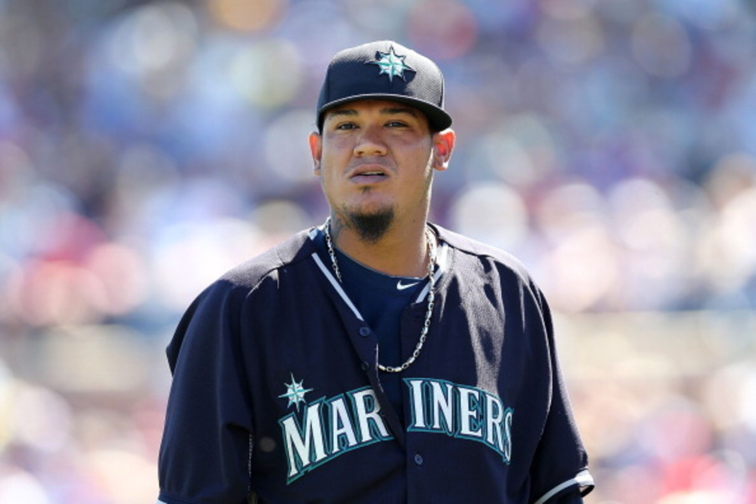 PEORIA, AZ - MARCH 09:  Starting pitcher Felix Hernandez #34 of the Seattle Mariners walks to the dugout during the spring training game against the Texas Rangers at Peoria Stadium on March 9, 2014 in Peoria, Arizona.  (Photo by Christian Petersen/Getty I