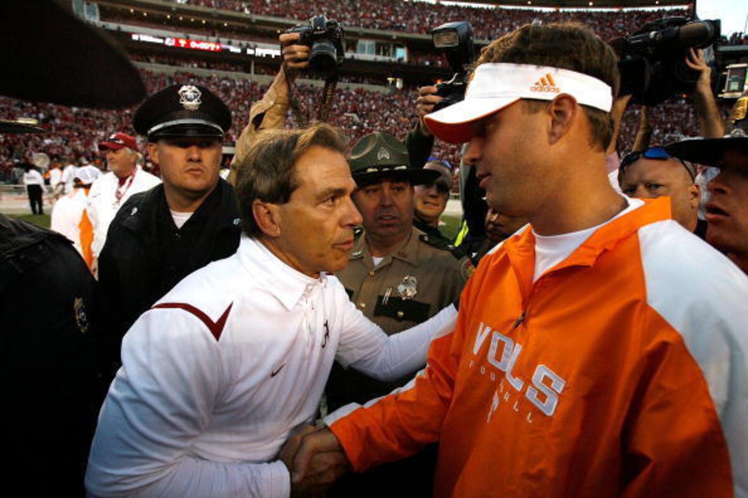 TUSCALOOSA, AL - OCTOBER 24:  Head coach Nick Saban (L) of the Alabama Crimson Tide shakes hands with head coach Lane Kiffin (R) of the Tennessee Volunteers after the Crimson Tide's 12-10 win at Bryant-Denny Stadium on October 24, 2009 in Tuscaloosa, Alab