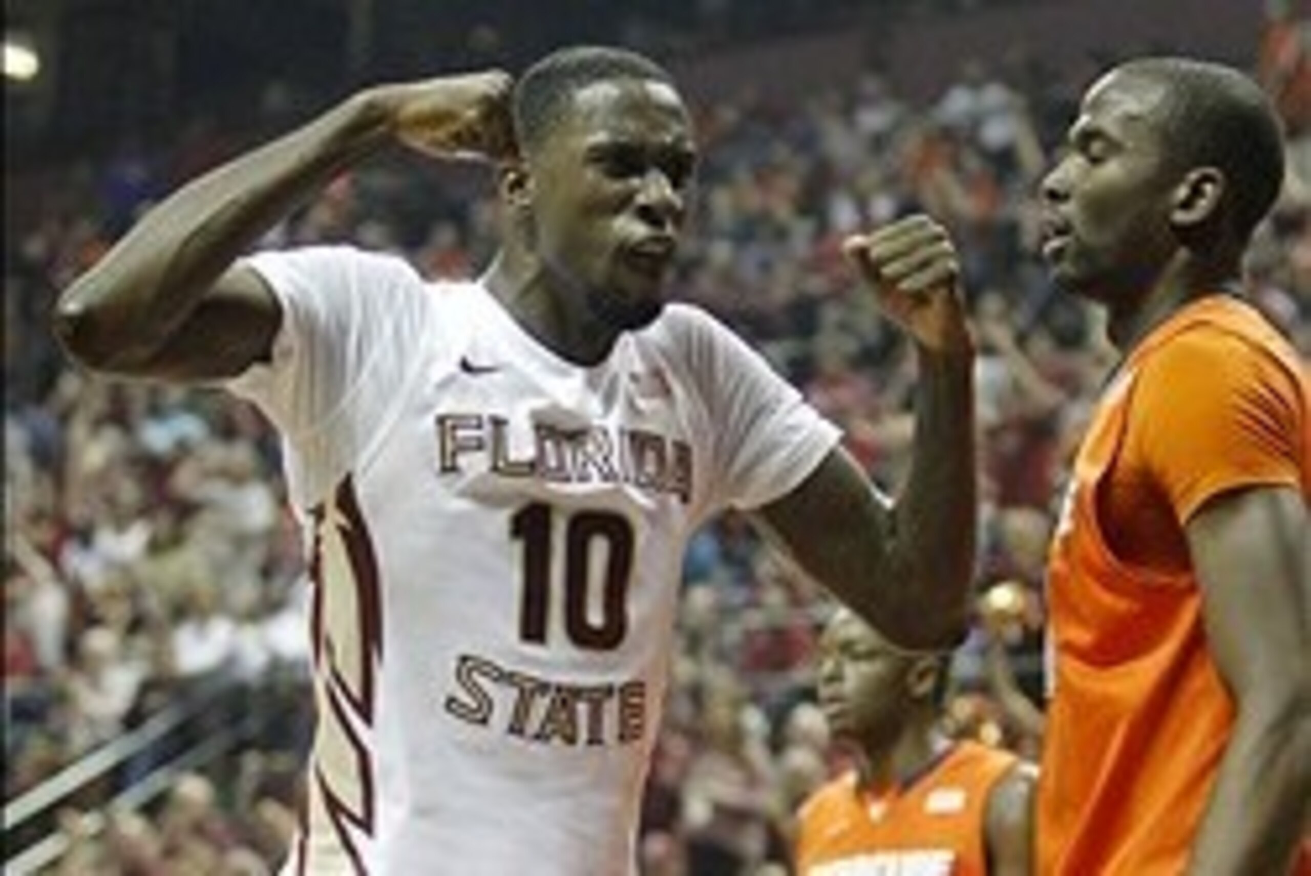 Mar 9, 2014; Tallahassee, FL, USA;  Florida State Seminoles forward Okaro White (10) celebraes after a dunk over Syracuse Orange center Baye-Moussa Keita (12) during the first half at Donald L. Tucker Center. Mandatory Credit: Matt Stamey-USA TODAY Sports