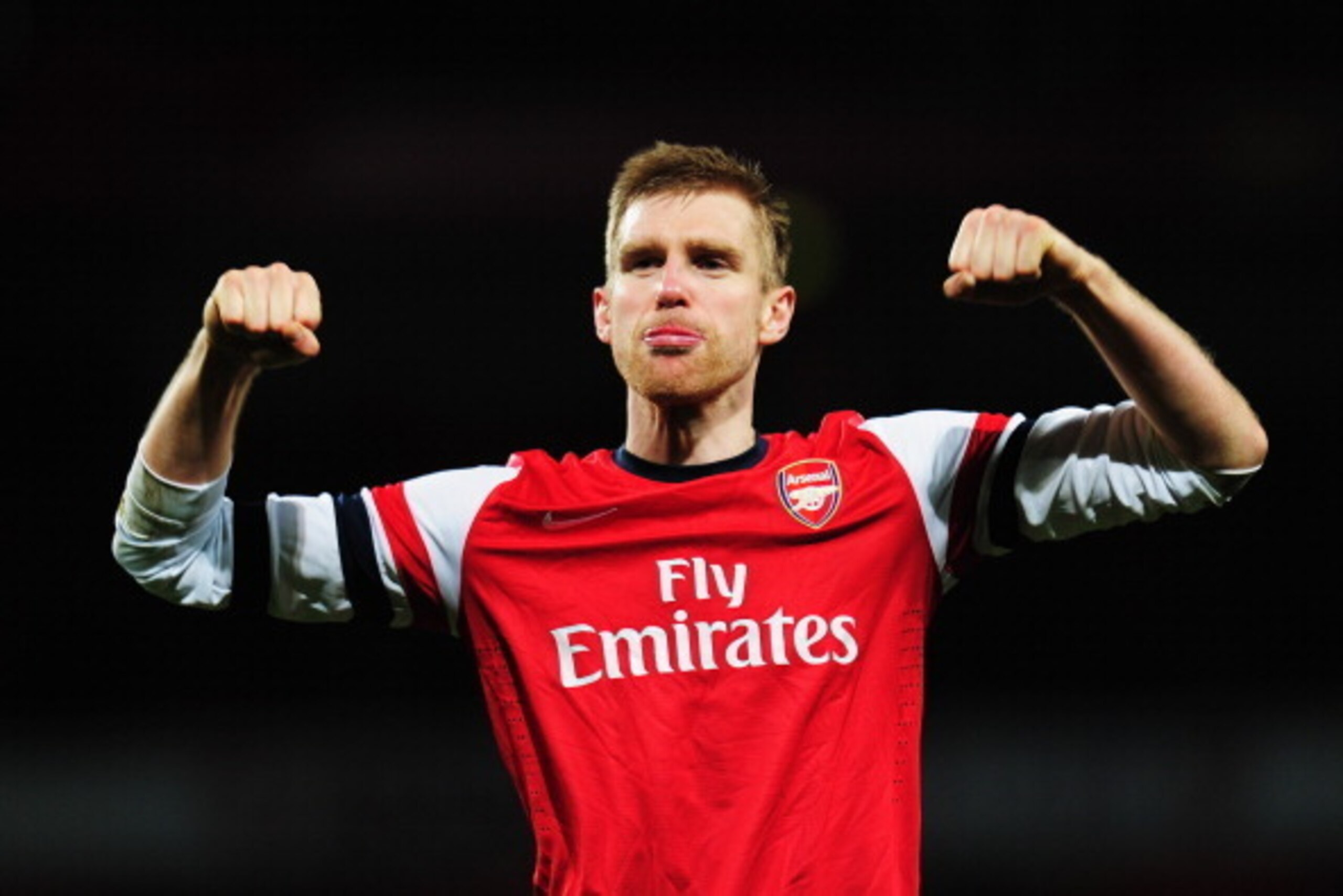 LONDON, ENGLAND - FEBRUARY 16: Per Mertesacker of Arsenal celebrates at the end of the FA Cup Fifth Round match between Arsenal and Liverpool at the Emirates Stadium on February 16, 2014 in London, England. (Photo by Shaun Botterill/Getty Images) LONDON, ENGLAND - FEBRUARY 16: Per Mertesacker of Arsenal celebrates at the end of the FA Cup Fifth Round match between Arsenal and Liverpool at the Emirates Stadium on February 16, 2014 in London, England. (Photo by Shaun Botterill/Getty Images)