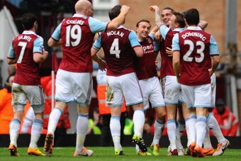 LONDON, ENGLAND - FEBRUARY 01:  Kevin Nolan of West Ham United (4) celebrates with team mates and Andy Carroll (3R) after his assist as he scores their second goal during the Barclays Premier League match between West Ham United and Swansea City at Boleyn