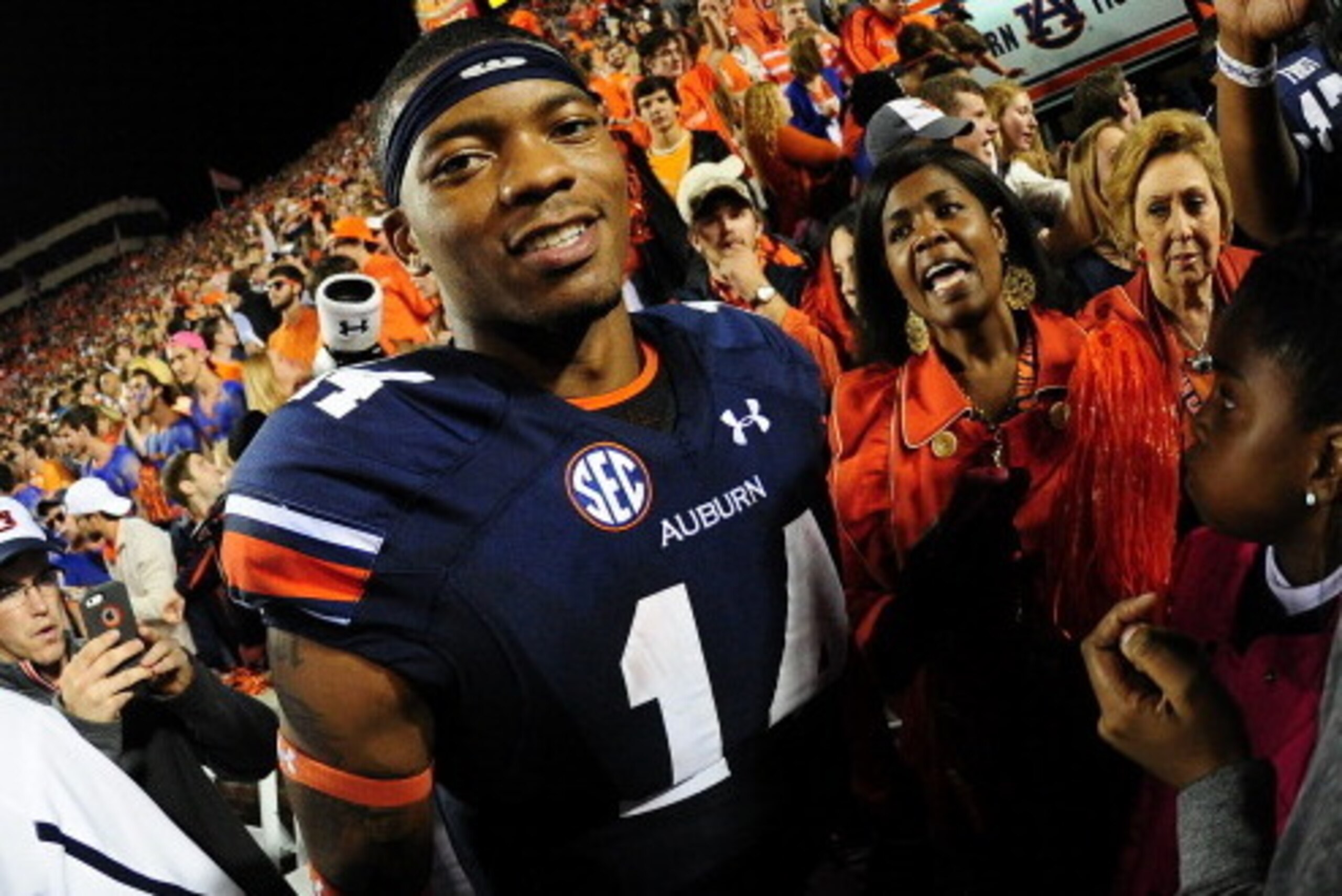 AUBURN, AL - NOVEMBER 16: Nick Marshall #14 of the Auburn Tigers celebrates after the game against the Georgia Bulldogs at Jordan-Hare Stadium on November 16, 2013 in Auburn Alabama. (Photo by Scott Cunningham/Getty Images)