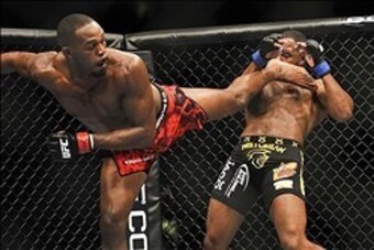 Apr 21, 2012; Atlanta, GA, USA; Jon Jones (left) fights Rashad Evans in the main event and light heavyweight title bout during UFC 145 at Philips Arena. Mandatory Credit: Paul Abell-USA TODAY Sports