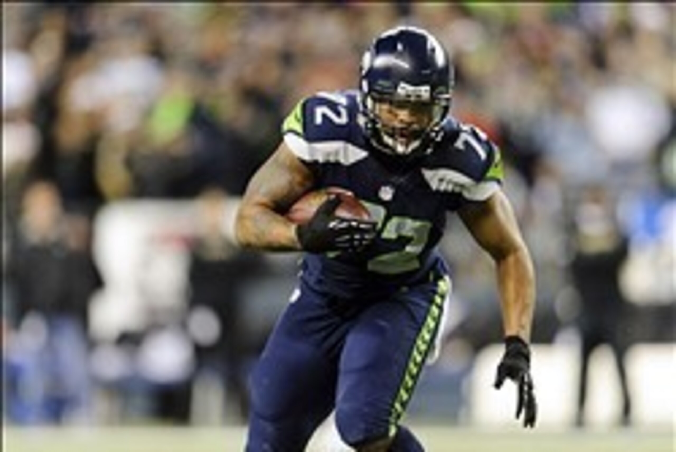 Dec 2, 2013; Seattle, WA, USA; Seattle Seahawks defensive end Michael Bennett (72) runs the ball in for a touchdown after recovering the fumble by New Orleans Saints quarterback Drew Brees (not pictured) during the 1st quarter at CenturyLink Field. Mandat