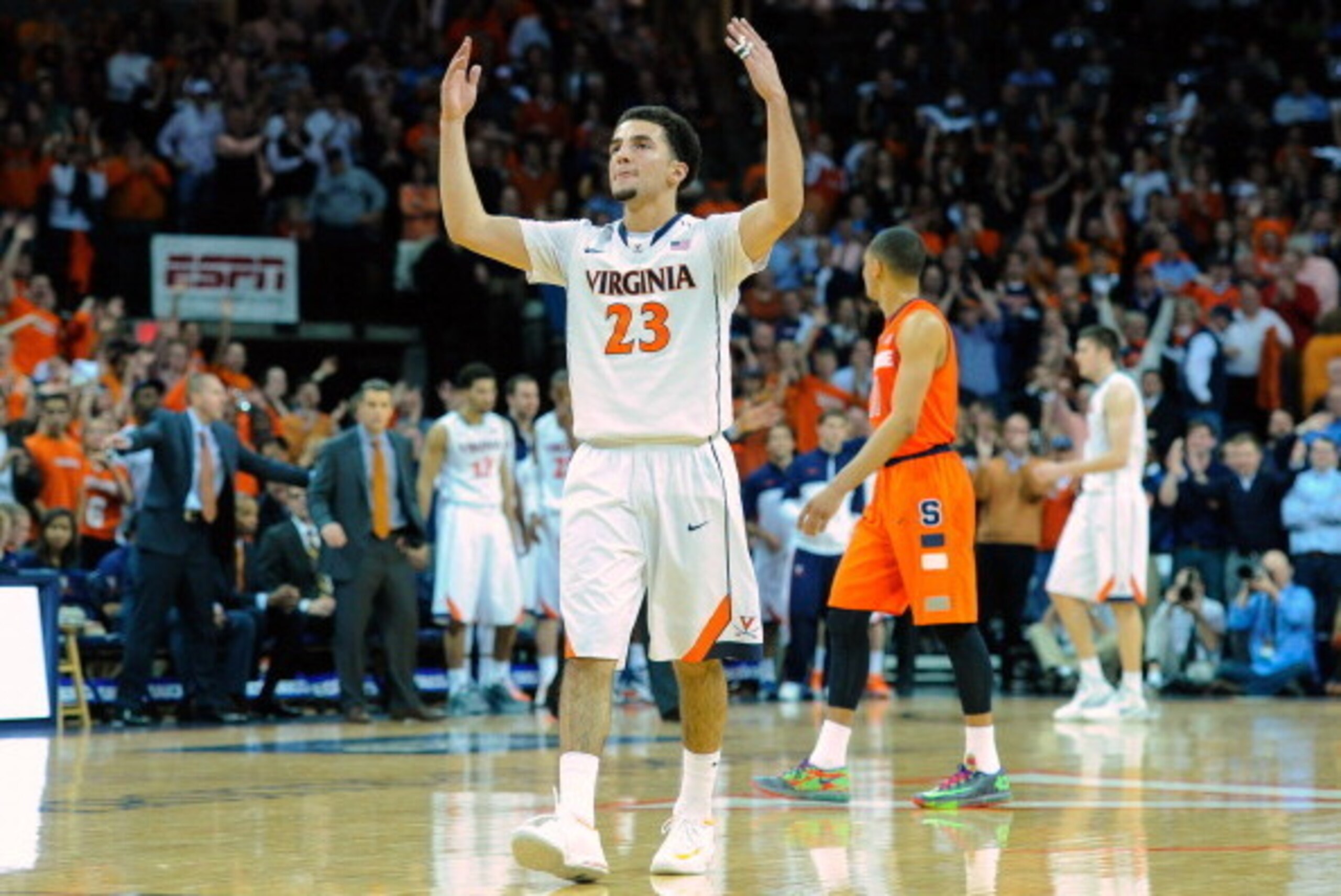 CHARLOTTESVILLE, VA - MARCH 01:  London Perrantes #23 of the Virginia Cavaliers celebrates against the Syracuse Orange during the second half at John Paul Jones Arena on March 1, 2014 in Charlottesville, Virginia.  Virginia defeated Syracuse 75-56.  (Phot