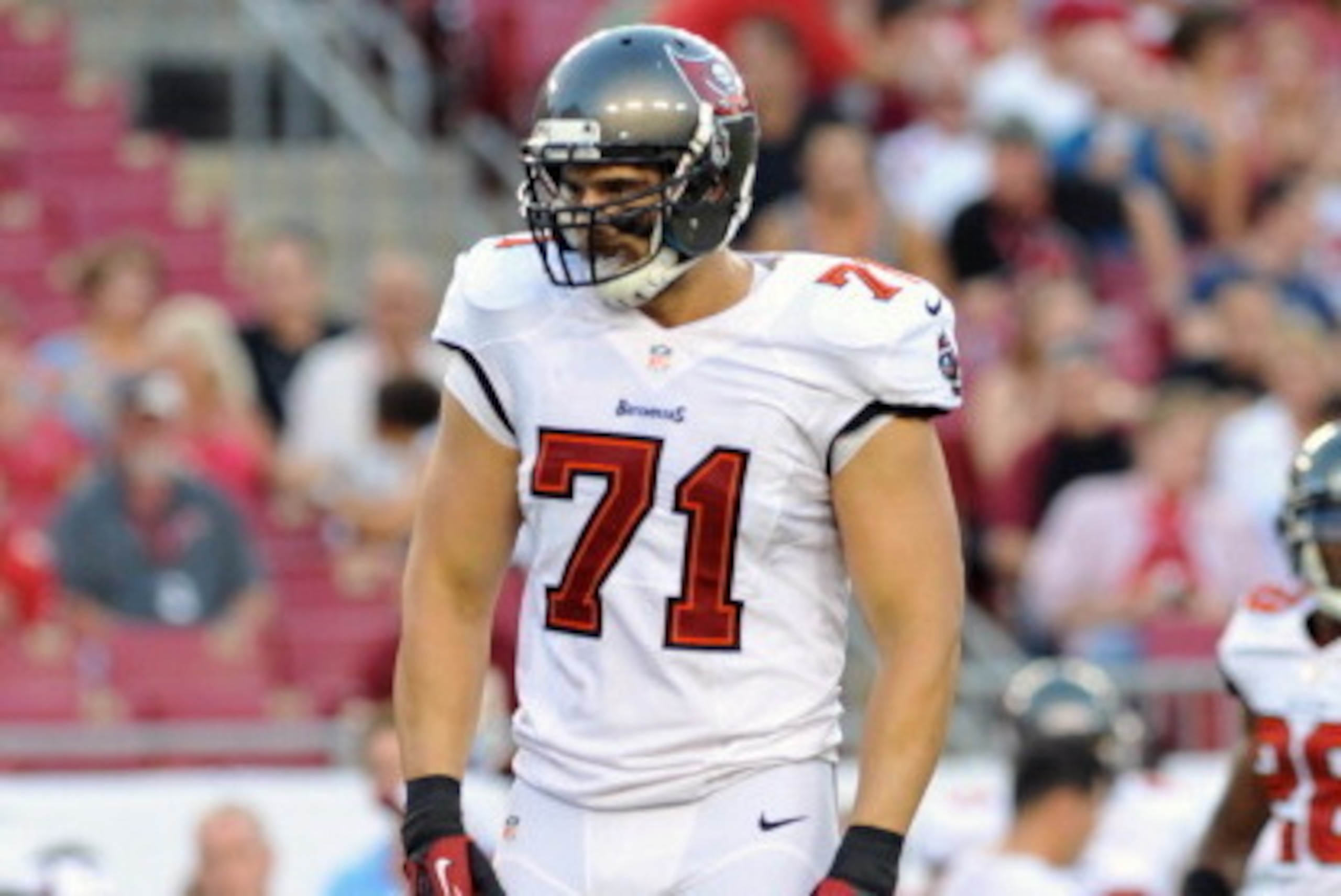 TAMPA, FL -  AUGUST 29:  Defensive end Trevor Scott #71 of the Tampa Bay Buccaneers sets for play against the Washington Redskins August 29, 2013 at Raymond James Stadium in Tampa, Florida. (Photo by Al Messerschmidt/Getty Images)