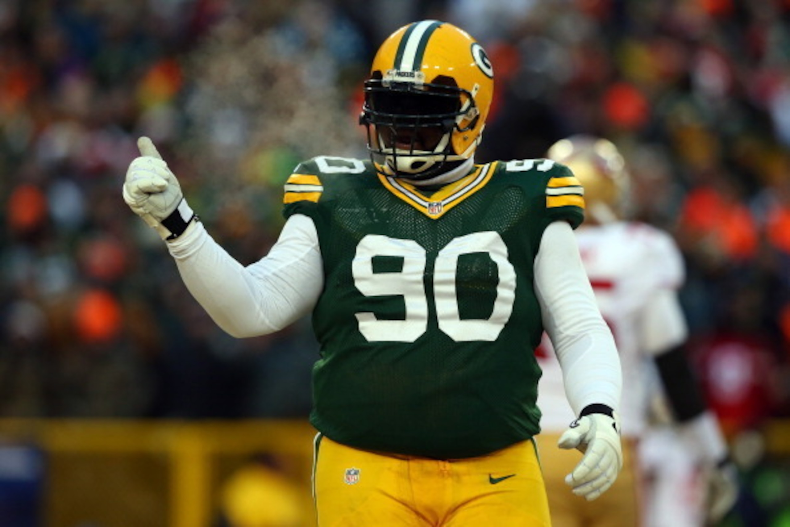 GREEN BAY, WI - JANUARY 05:  B.J. Raji #90 of the Green Bay Packers celebrates a incomplete pass by the San Francisco 49ers in the first quarter during their NFC Wild Card Playoff game at Lambeau Field on January 5, 2014 in Green Bay, Wisconsin.  (Photo b