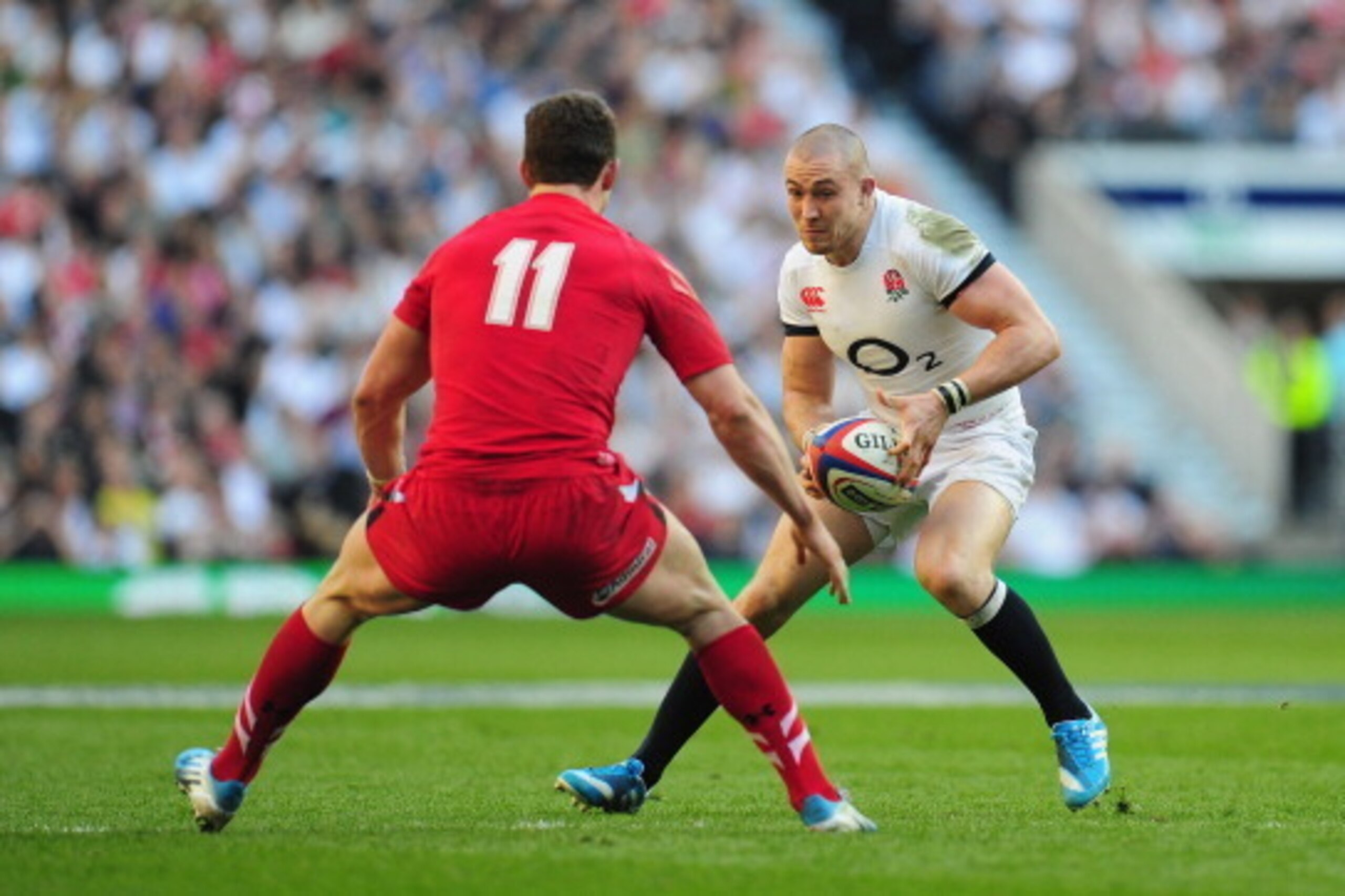 LONDON, ENGLAND - MARCH 09:  England player Mike Brown goes past George North during the RBS Six Nations match between England and Wales at Twickenham Stadium on March 9, 2014 in London, England.  (Photo by Stu Forster/Getty Images)