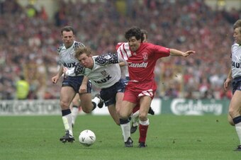 1992:  Anton Rogan (left) of Sunderland and Dean Saunders (right) of Liverpool struggle for possession of the ball during the FA Cup final at Wembley Stadium in London. Liverpool won the match 2-0. \ Mandatory Credit: Shaun  Botterill/Allsport