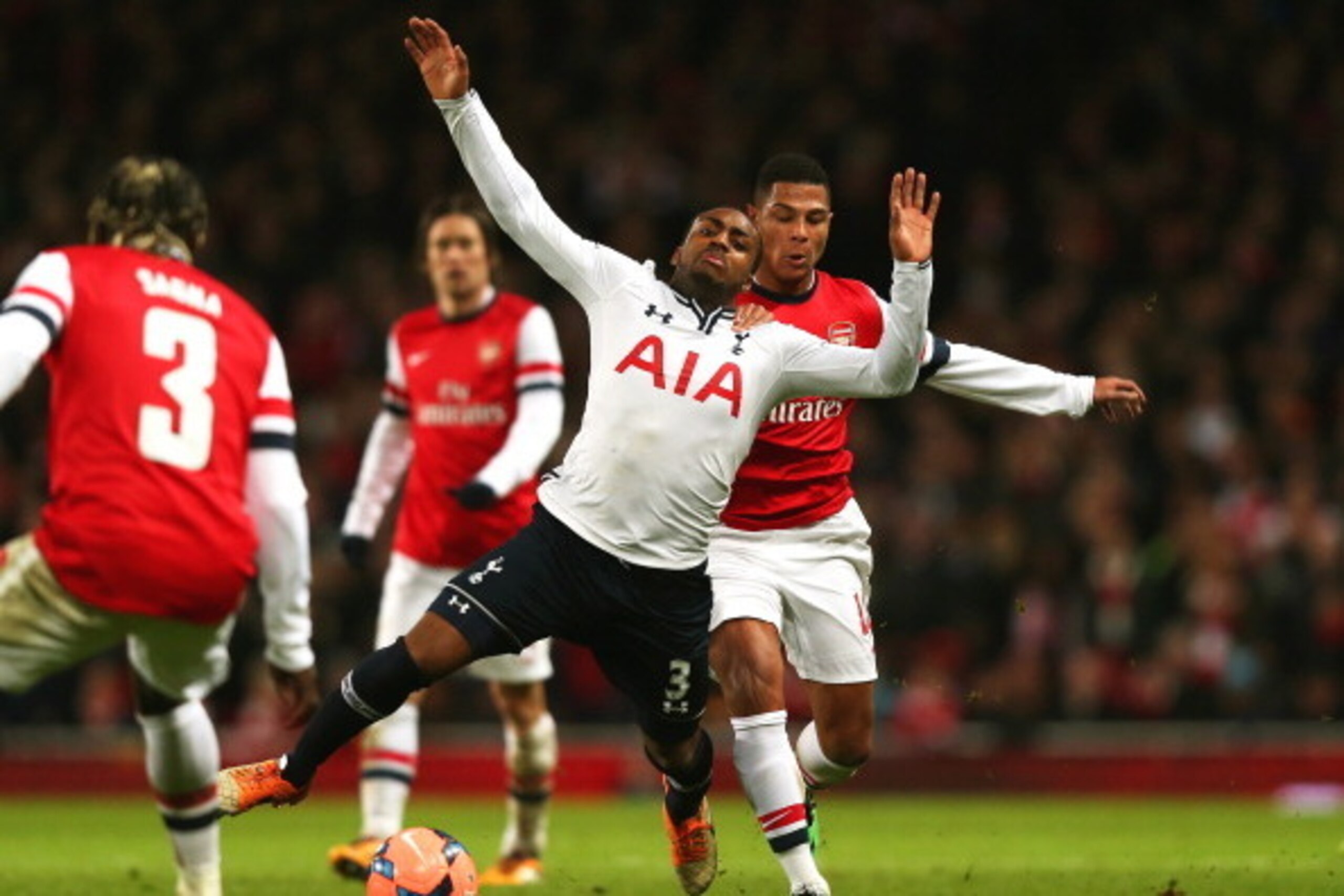 LONDON, ENGLAND - JANUARY 04: Danny Rose of Spurs is brought down by Serge Gnabry of Arsenal during the Budweiser FA Cup third round match between Arsenal and Tottenham Hotspur at Emirates Stadium on January 4, 2014 in London, England. (Photo by Clive R LONDON, ENGLAND - JANUARY 04: Danny Rose of Spurs is brought down by Serge Gnabry of Arsenal during the Budweiser FA Cup third round match between Arsenal and Tottenham Hotspur at Emirates Stadium on January 4, 2014 in London, England. (Photo by Clive R