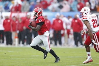 JACKSONVILLE, FL - JANUARY 1: J.J. Green #15 of the Georgia Bulldogs returns a kickoff 48 yards to set up a field goal in the first half against the Nebraska Cornhuskers during the TaxSlayer.com Gator Bowl at Everbank Field on January 1, 2014 in Jacksonvi