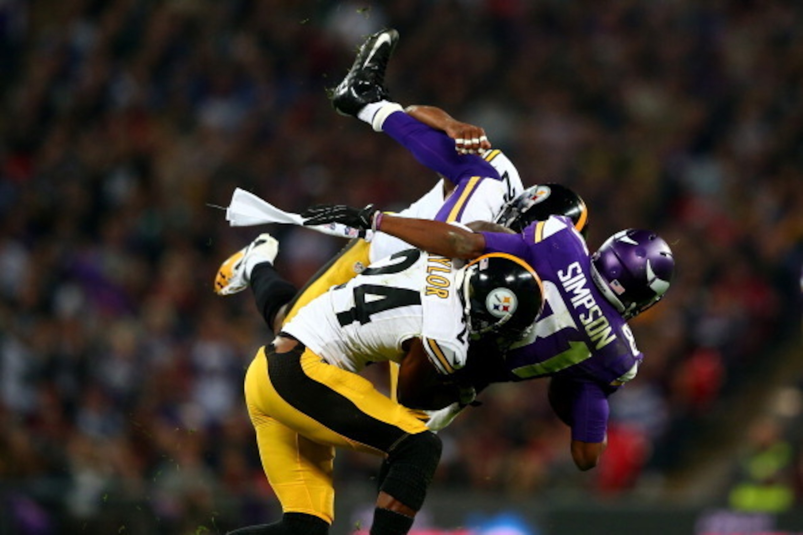 LONDON, ENGLAND - SEPTEMBER 29:  Wide receiver Jerome Simpson #81 of the Minnesota Vikings is tackled by cornerback Ike Taylor #24 of the Pittsburgh Steelers during the NFL International Series game between Pittsburgh Steelers and Minnesota Vikings at Wem