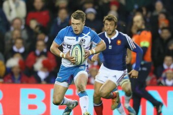 EDINBURGH, SCOTLAND - MARCH 08:  Stuart Hogg of Scotland breaks with the ball during the RBS Six Nations match between Scotland and France at Murrayfield Stadium on March 8, 2014 in Edinburgh, Scotland.  (Photo by David Rogers/Getty Images)