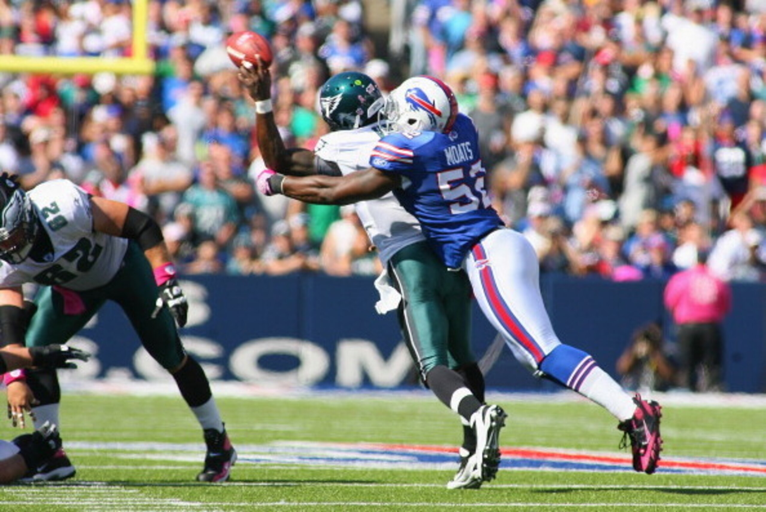 ORCHARD PARK, NY - OCTOBER 09:  Arthur Moats #52 of the Buffalo Bills hits Michael Vick #7 of the Philadelphia Eagles causing Vick to throw an interception in the first half  at Ralph Wilson Stadium on October 9, 2011 in Orchard Park, New York.  (Photo by