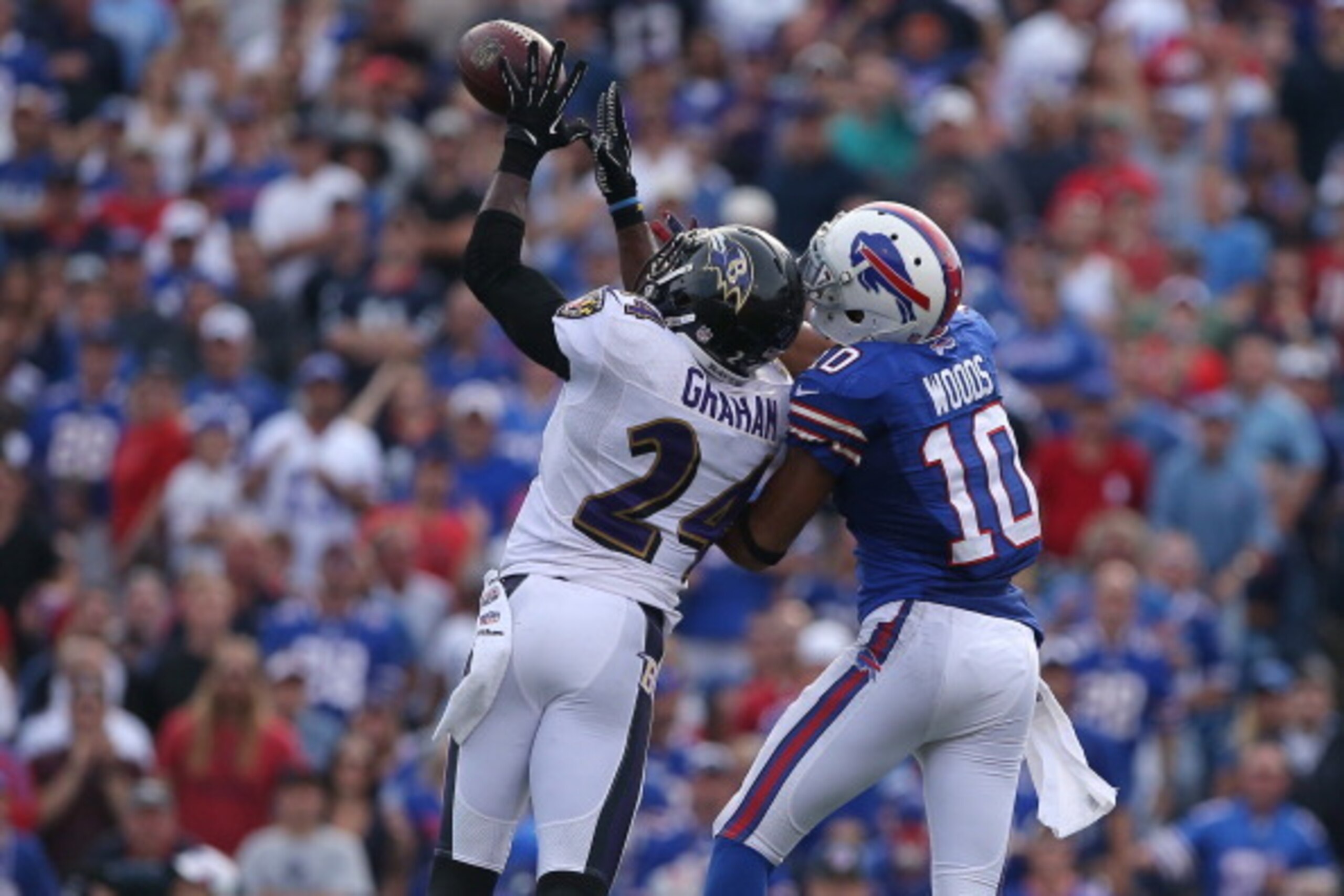 ORCHARD PARK, NY - SEPTEMBER 29: Corey Graham #24 of the Baltimore Ravens intercepts a pass during NFL game action intended for Robert Woods #10 of the Buffalo Bills at Ralph Wilson Stadium on September 29, 2013 in Orchard Park, New York. (Photo by Tom Sz