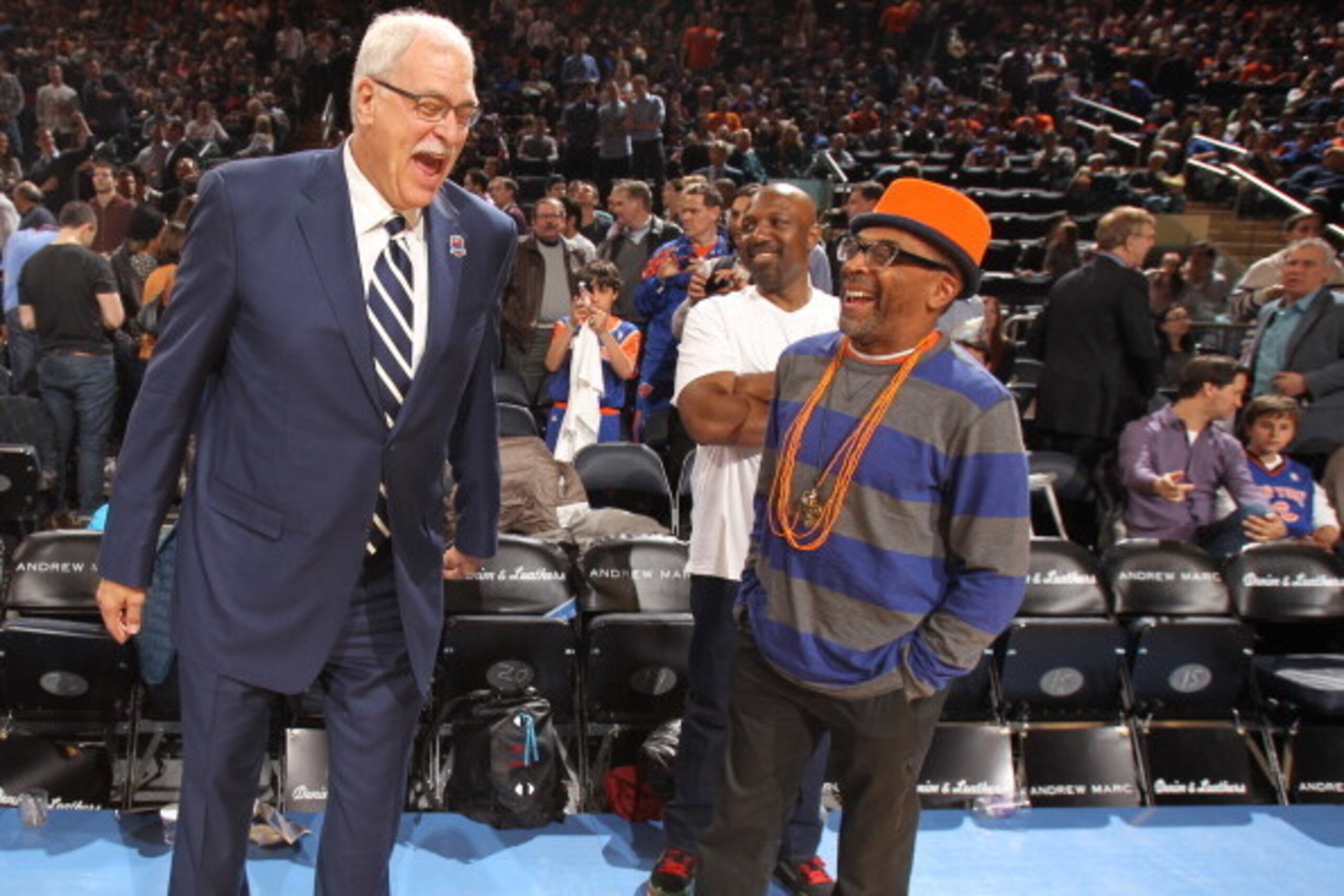 NEW YORK, NY - April 5: Phil Jackson and Spike Lee share a laugh before the game between the New York Knicks and the Milwaukee Bucks on April 5, 2013 at Madison Square Garden in New York City.  NOTE TO USER: User expressly acknowledges and agrees that, by
