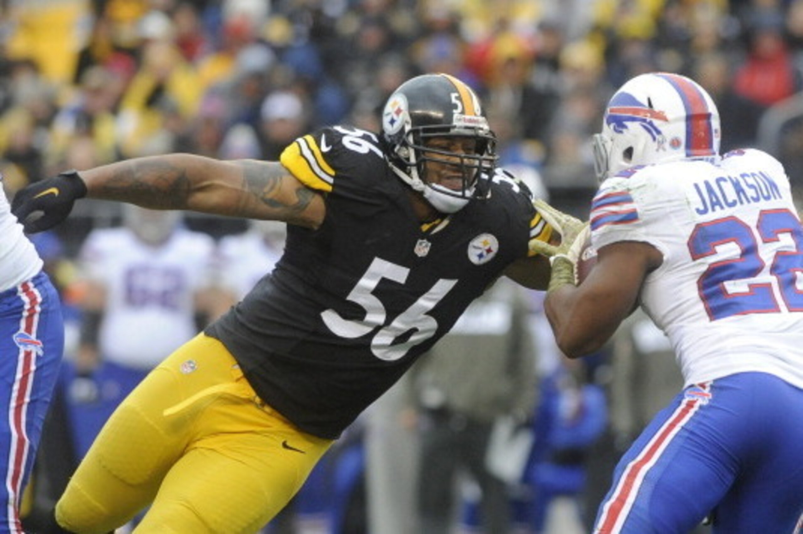PITTSBURGH, PA - NOVEMBER 10: LaMarr Woodley #56 of the Pittsburgh Steelers stretches to tackle Fred Jackson #22 of the Buffalo Bills during the second quarter at Heinz Field on November 10, 2013 in Pittsburgh, Pennsylvania. (Photo by Vincent Pugliese/Get