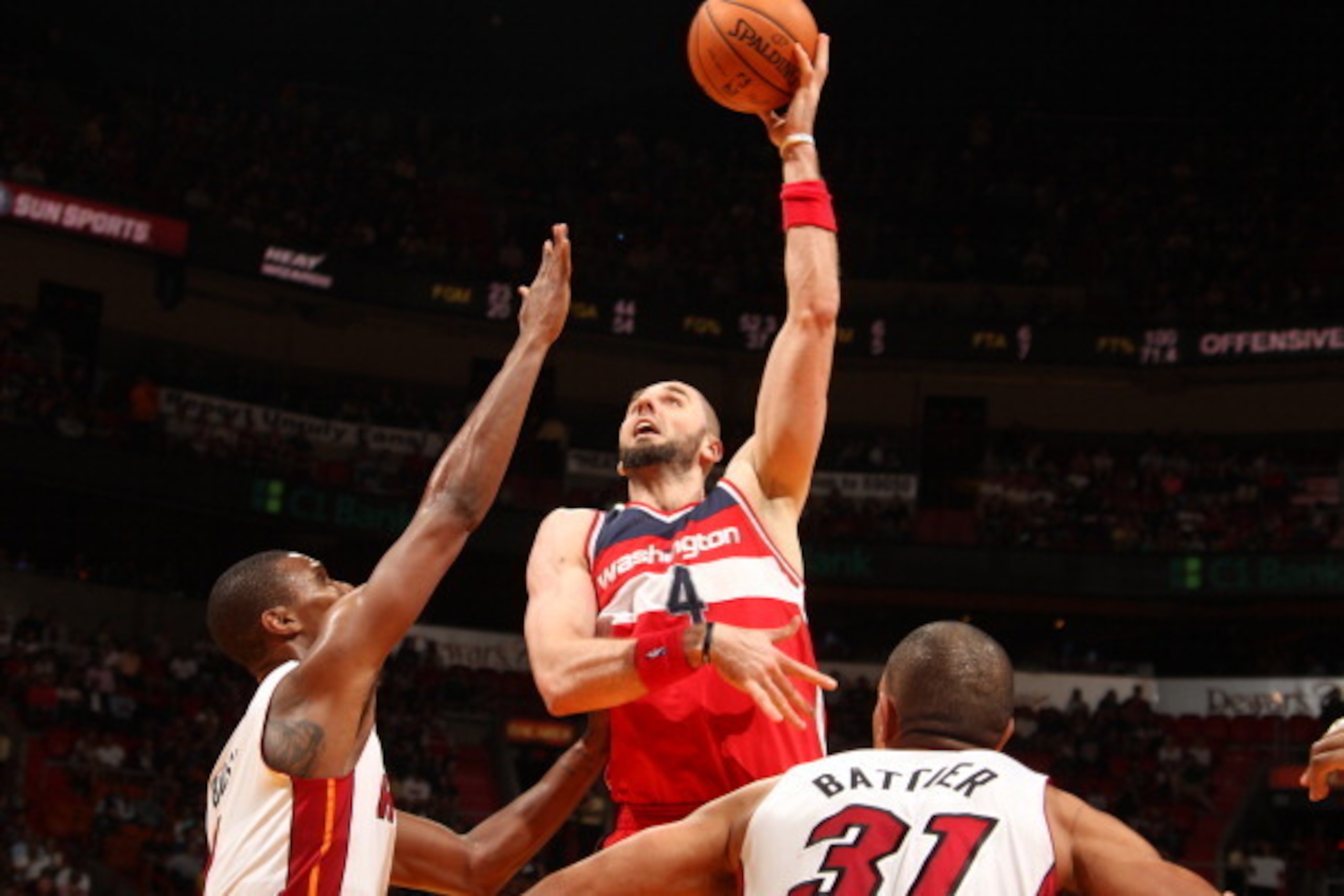 MIAMI, FL - March 10: Marcin Gortat #4 of the Washington Wizards shoots the ball against the Miami Heat at the American Airlines Arena in Miami, Florida on March 10 2014. NOTE TO USER: User expressly acknowledges and agrees that, by downloading and/or usi