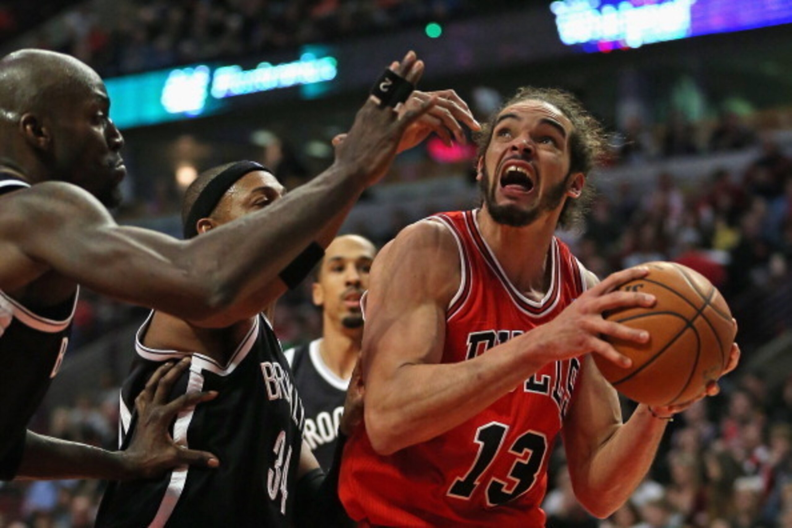 CHICAGO, IL - FEBRUARY 13: Joakim Noah #13 of the Chicago Bulls readies to shoot against Kevin Garnett #2 and Paul Pierce #34 of the Brooklyn Nets at the United Center on February 13, 2014 in Chicago, Illinois. The Bulls defeated the Nets 92-76. NOTE TO U