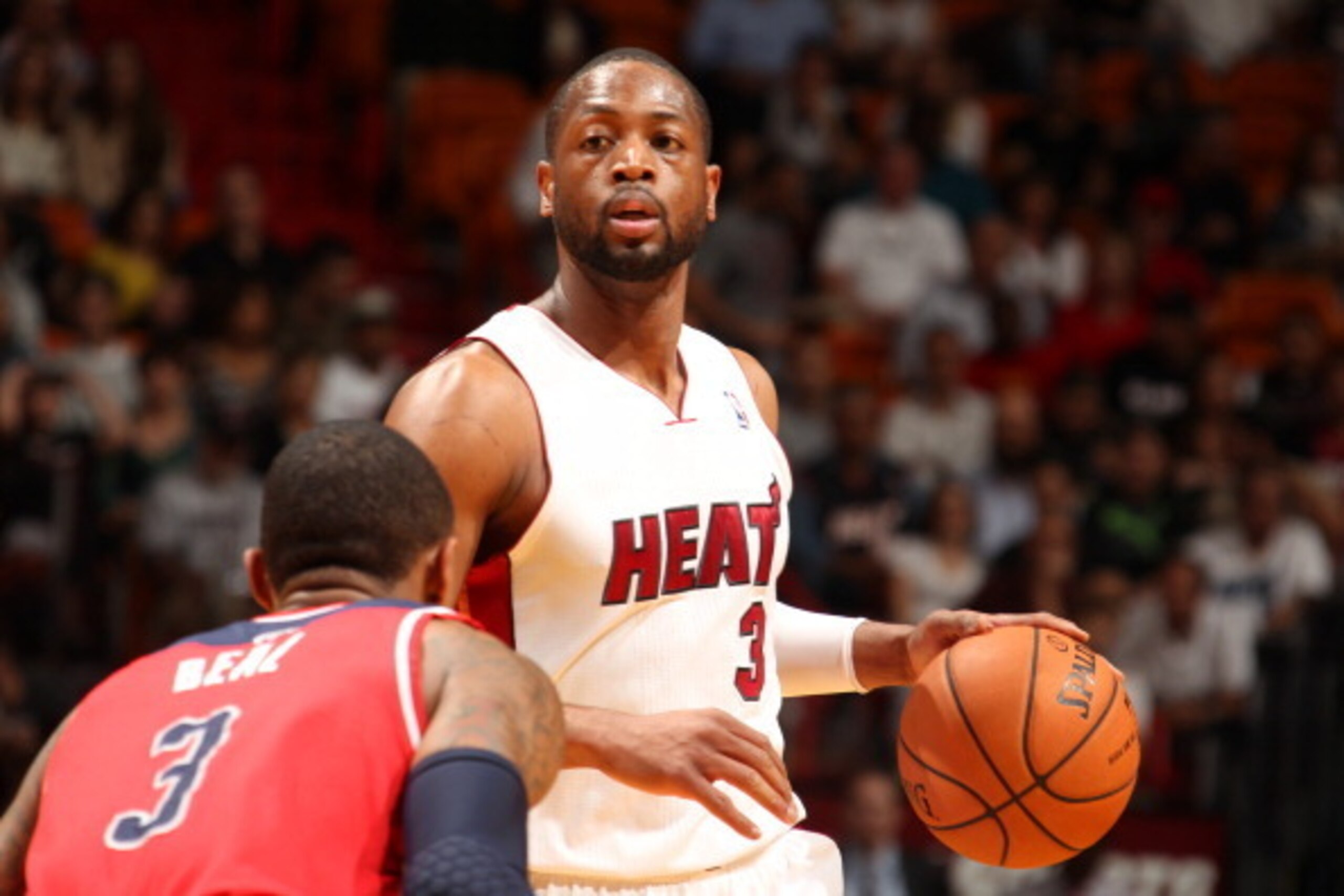 MIAMI, FL - March 10: Dwyane Wade #3 of the Miami Heat dribbles the ball against the Washington Wizards at the American Airlines Arena in Miami, Florida on March 10 2014. NOTE TO USER: User expressly acknowledges and agrees that, by downloading and/or usi