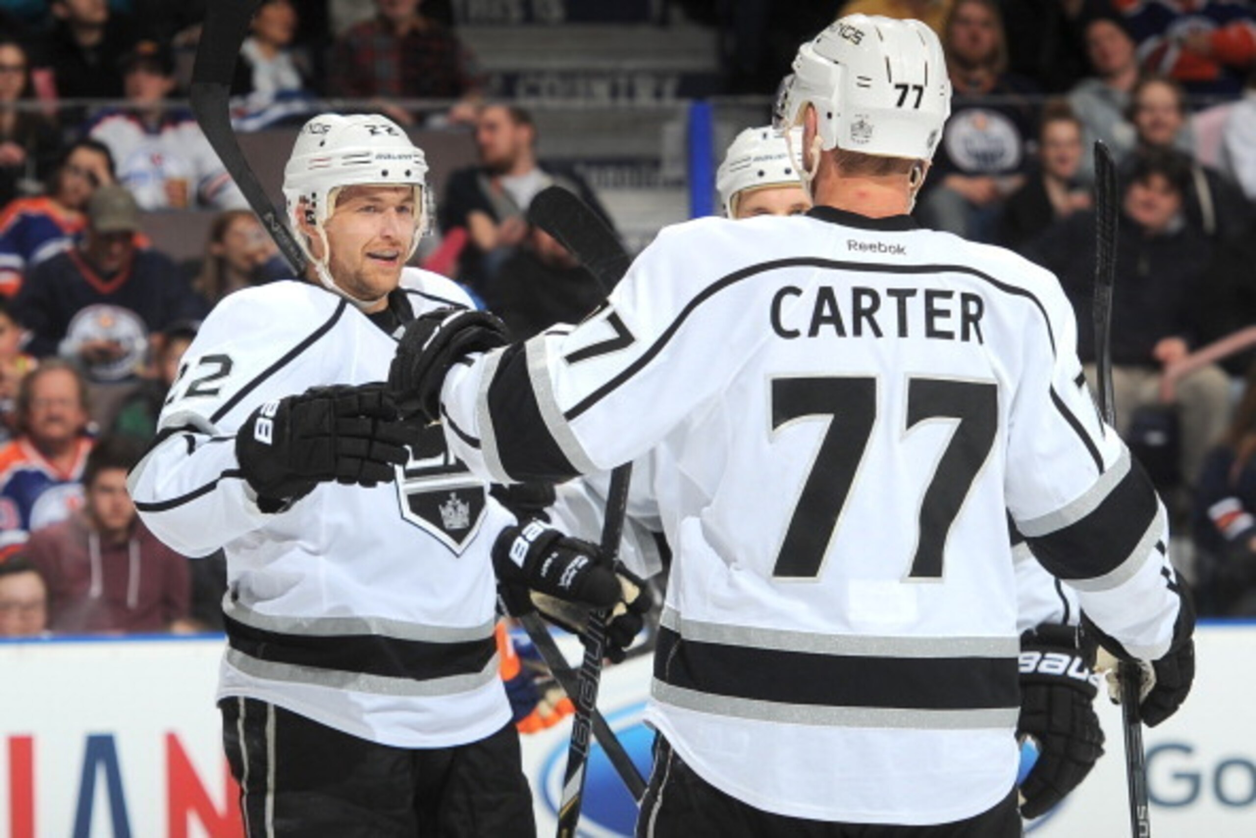 EDMONTON, AB - MARCH 9: Trevor Lewis #22 and Jeff Carter #77 of the Los Angeles Kings celebrate after a goal in a game against the Edmonton Oilers on March 9, 2014 at Rexall Place in Edmonton, Alberta, Canada. (Photo by Andy Devlin/NHLI via Getty Images)